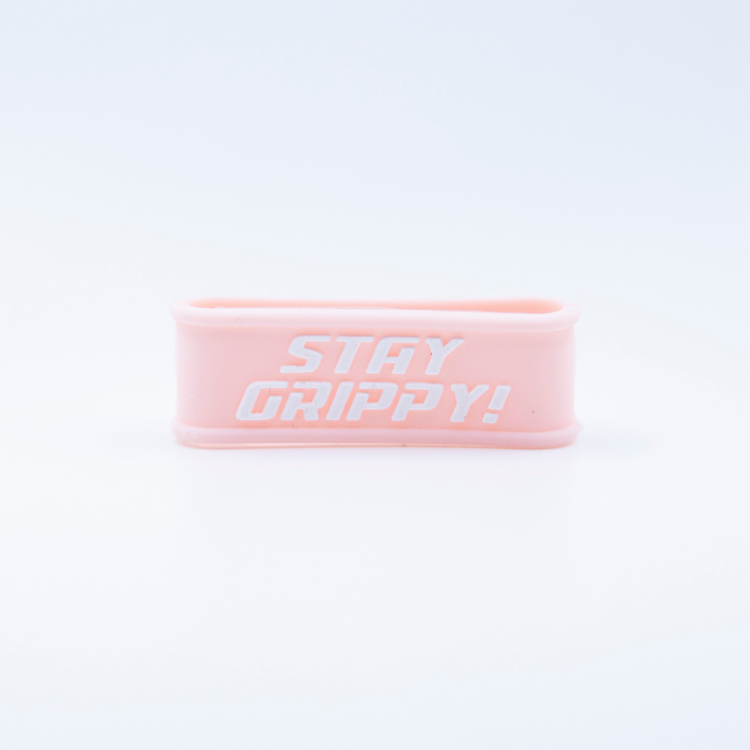 Pink rubber band with white "STAY GRIPPY!" text.
