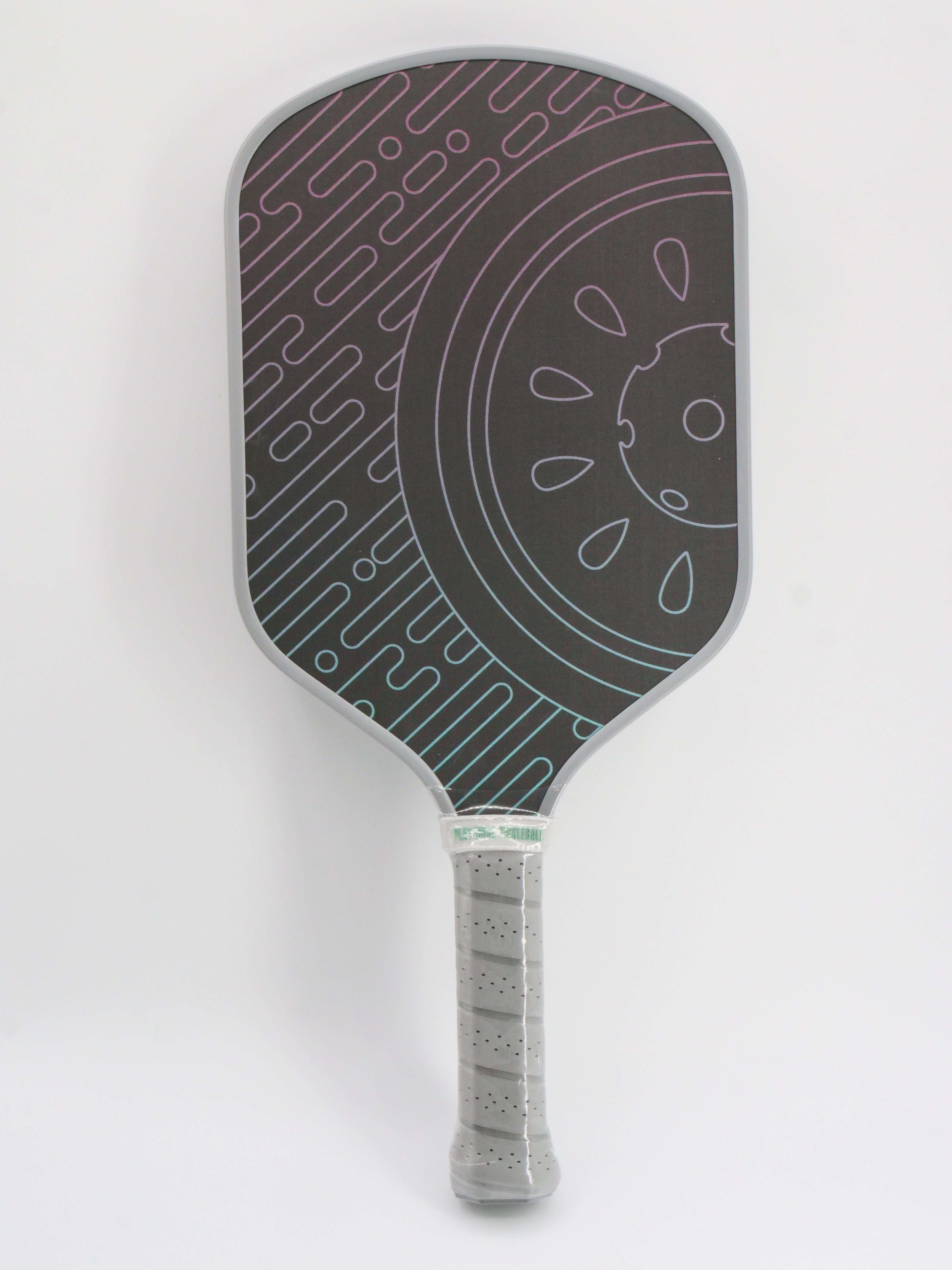 Pickleball paddle with grey trim, black face, and colorful geometric design.