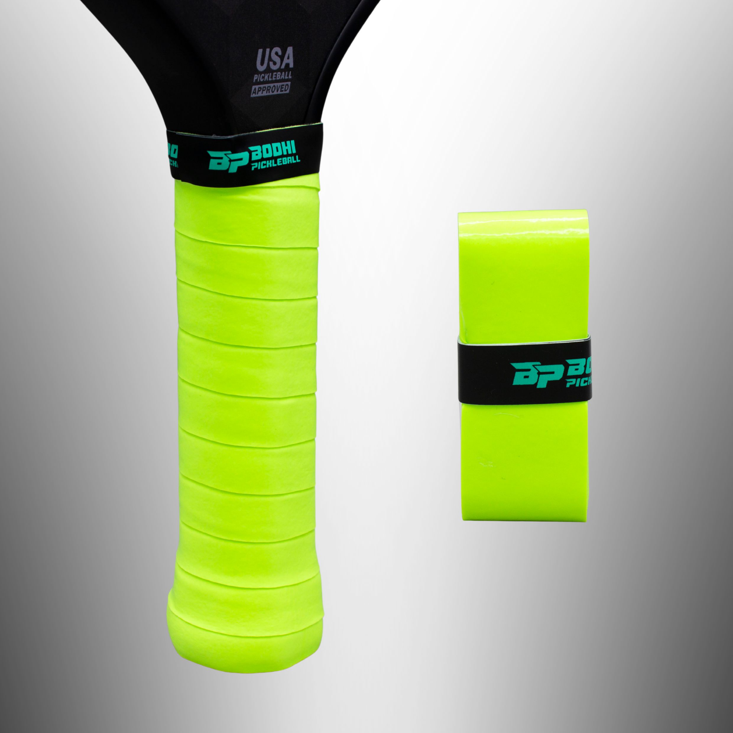 Neon green pickleball paddle overgrip by Bodhi Pickleball, on a handle with 'USA PICKLEBALL APPROVED' text, next to a matching roll.