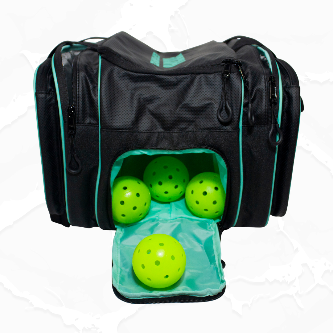 Black textured duffle bag by Bodhi Pickleball with teal accents, featuring an open front pocket displaying four lime green pickleballs.