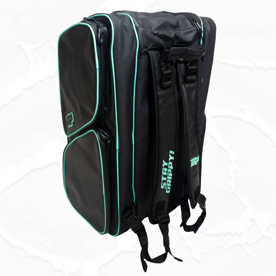 Textured black duffle bag by Bodhi Pickleball with teal piping, 'STAY GRIPPY!' text, and BP logo, shown from the side.