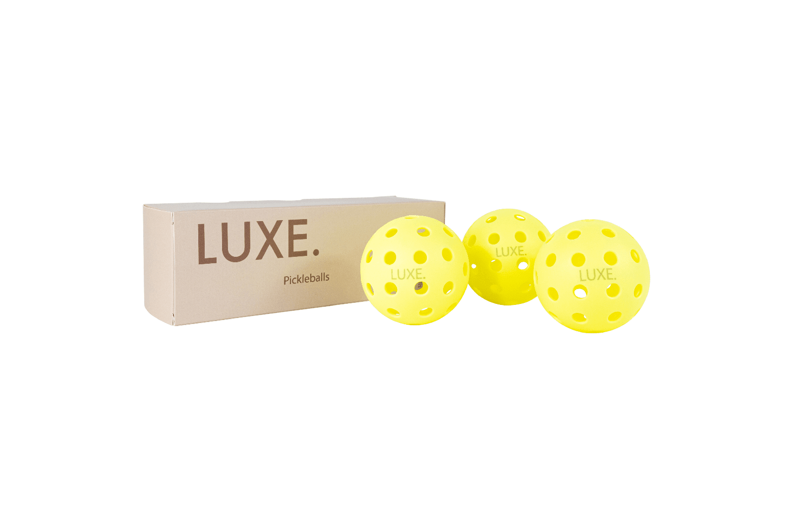 A box of Luxe pickleballs next to three yellow pickleballs.