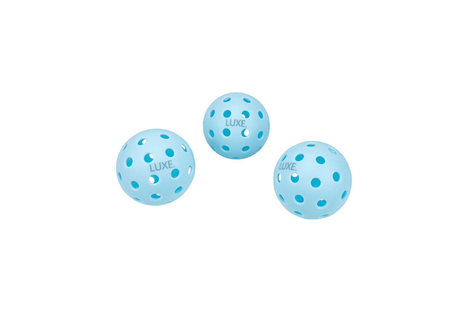 Three blue pickleballs with "LUXE" printed on them against a green background.