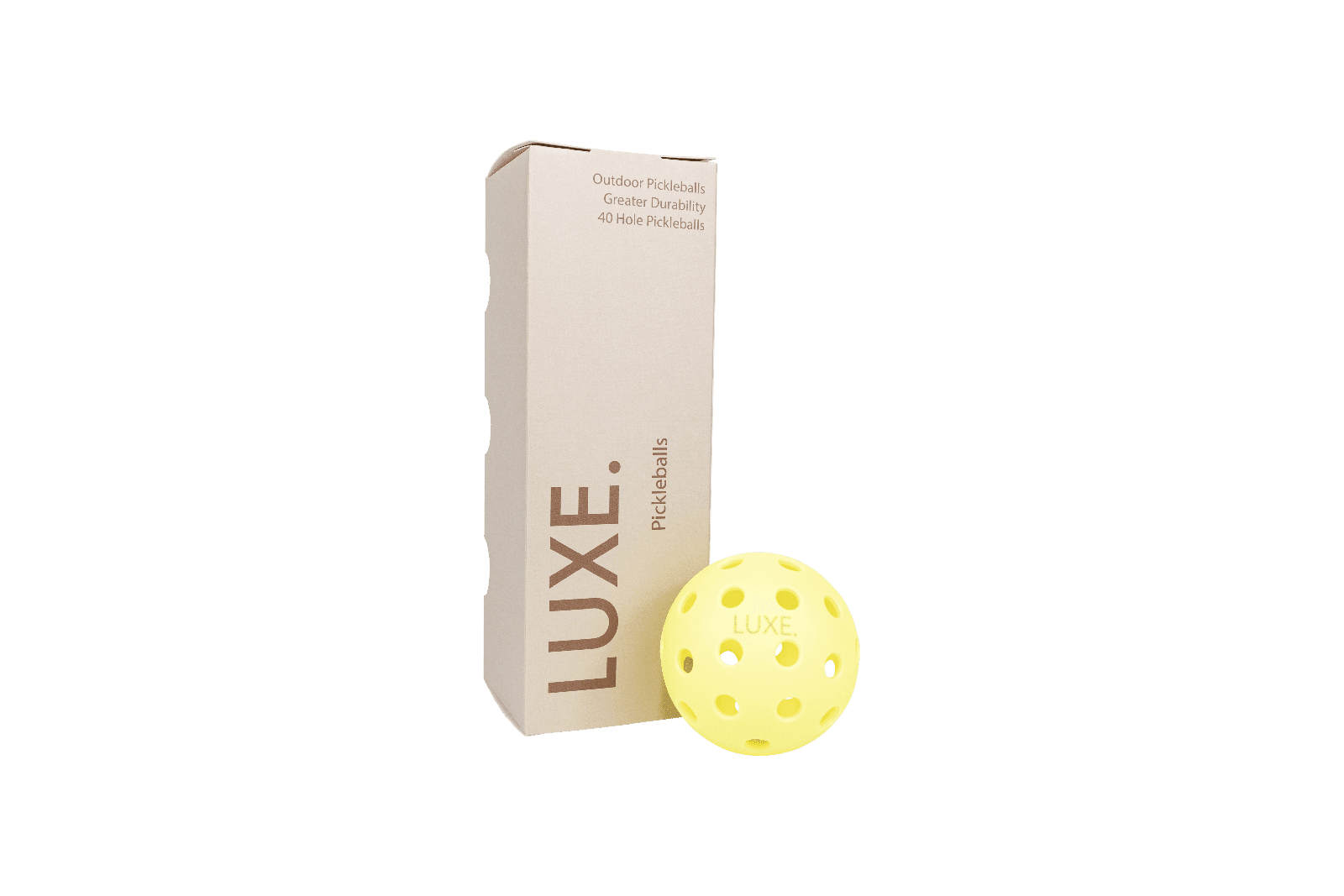 Box of Luxe pickleballs with a yellow pickleball next to it.