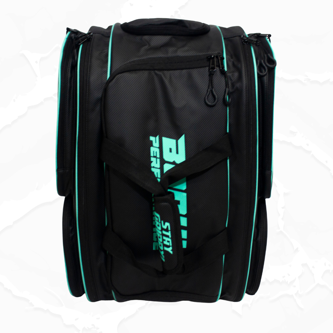 A black duffle bag by Bodhi Pickleball with teal piping, subtle carbon fiber texture, and a prominent teal logo on the front.