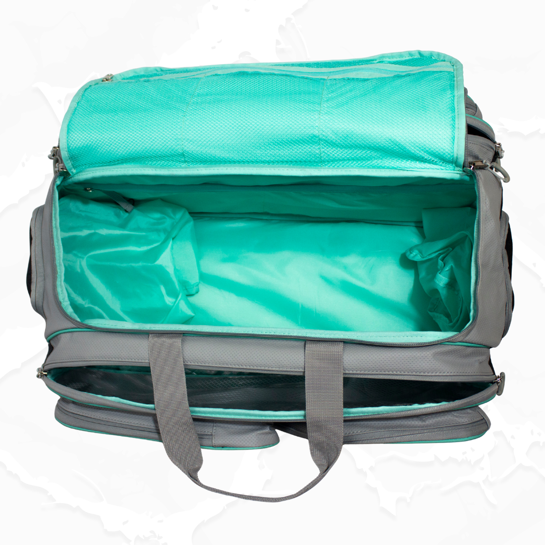 Grey duffle bag by Bodhi Pickleball with a vibrant teal interior, shown open from above with mesh and zippered compartments.