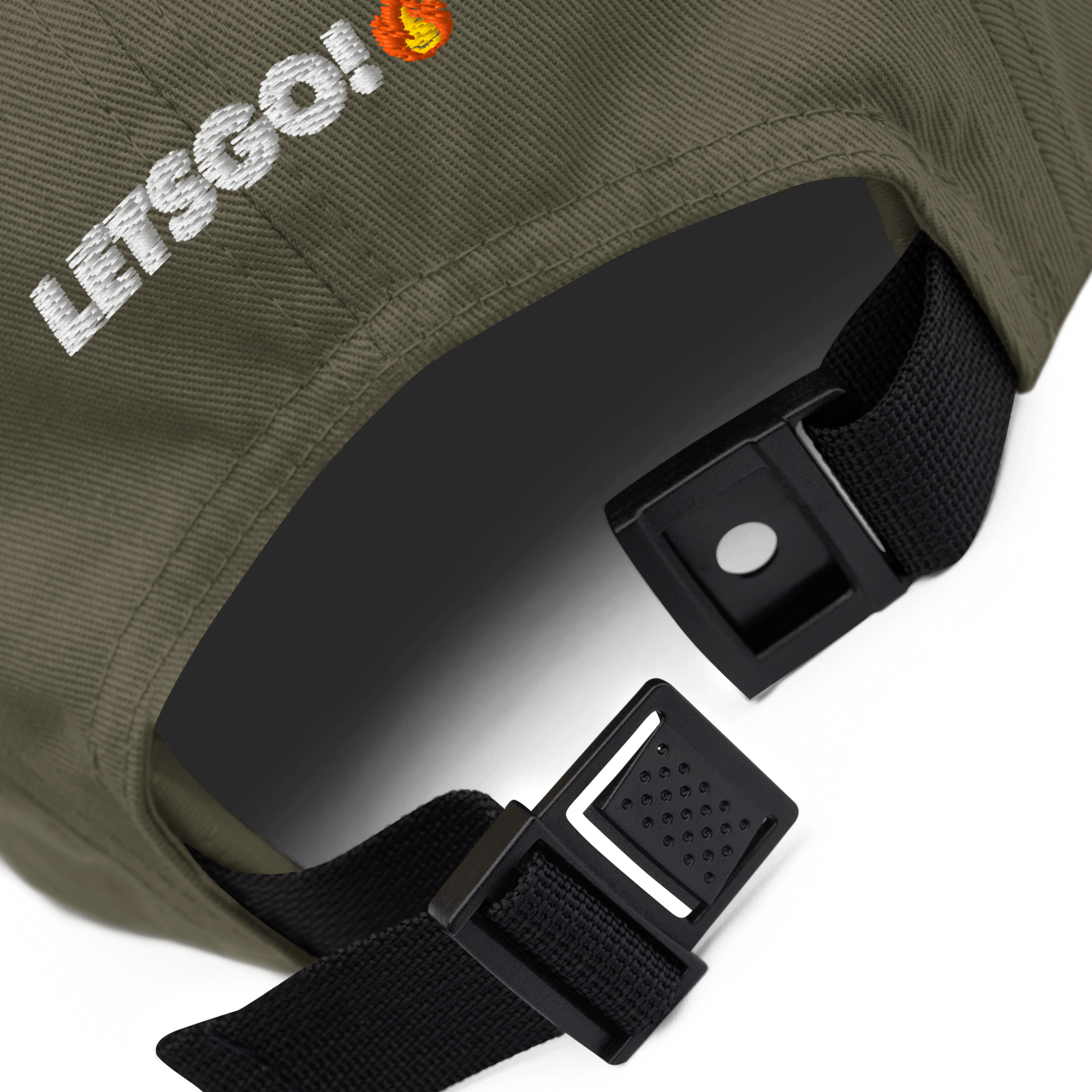 Close-up of a khaki cap with "LETSGO!" and a flame embroidered on the side, and an adjustable black strap with plastic buckle.