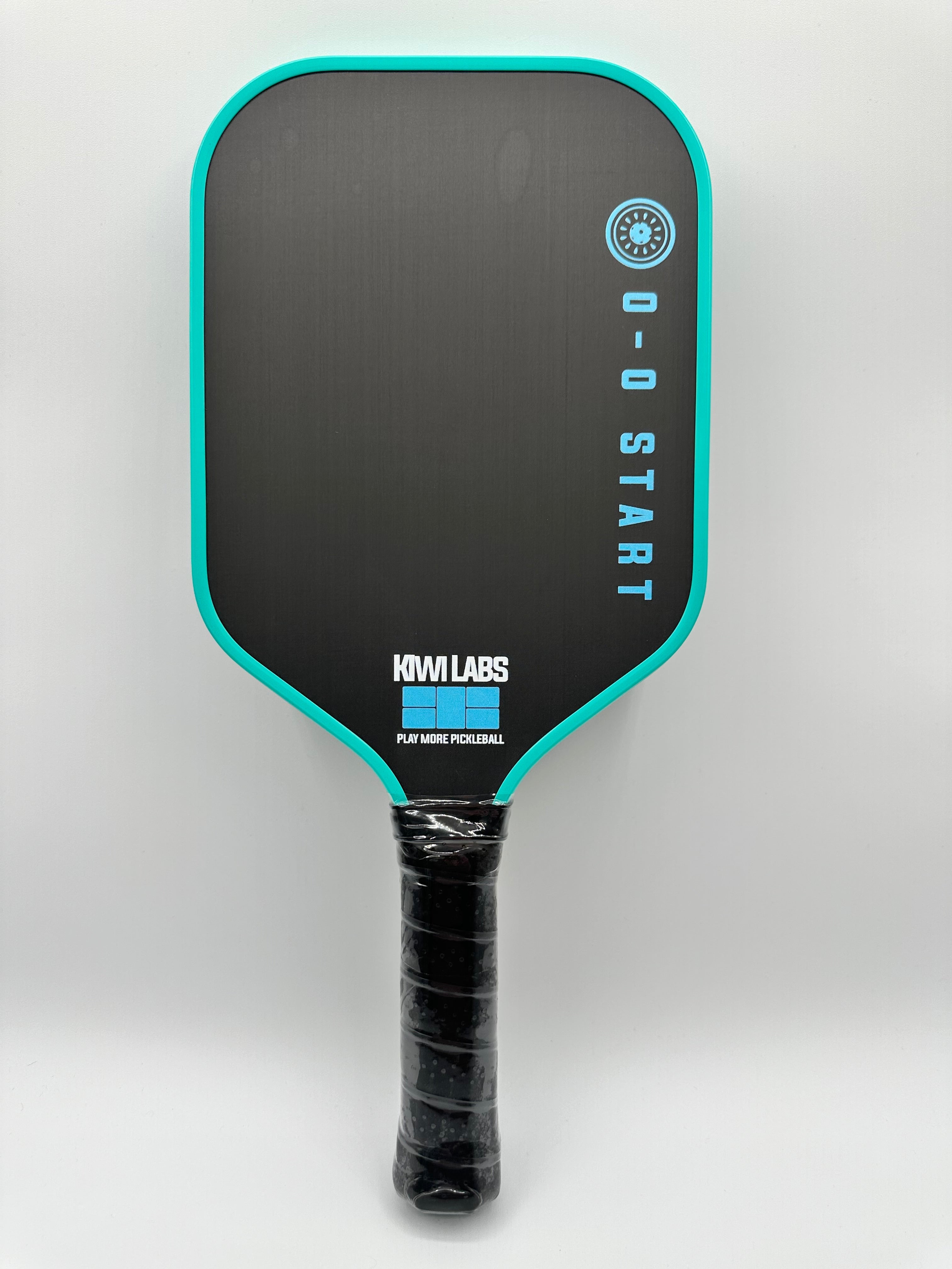 Black and turquoise Kiwi Labs pickleball paddle.