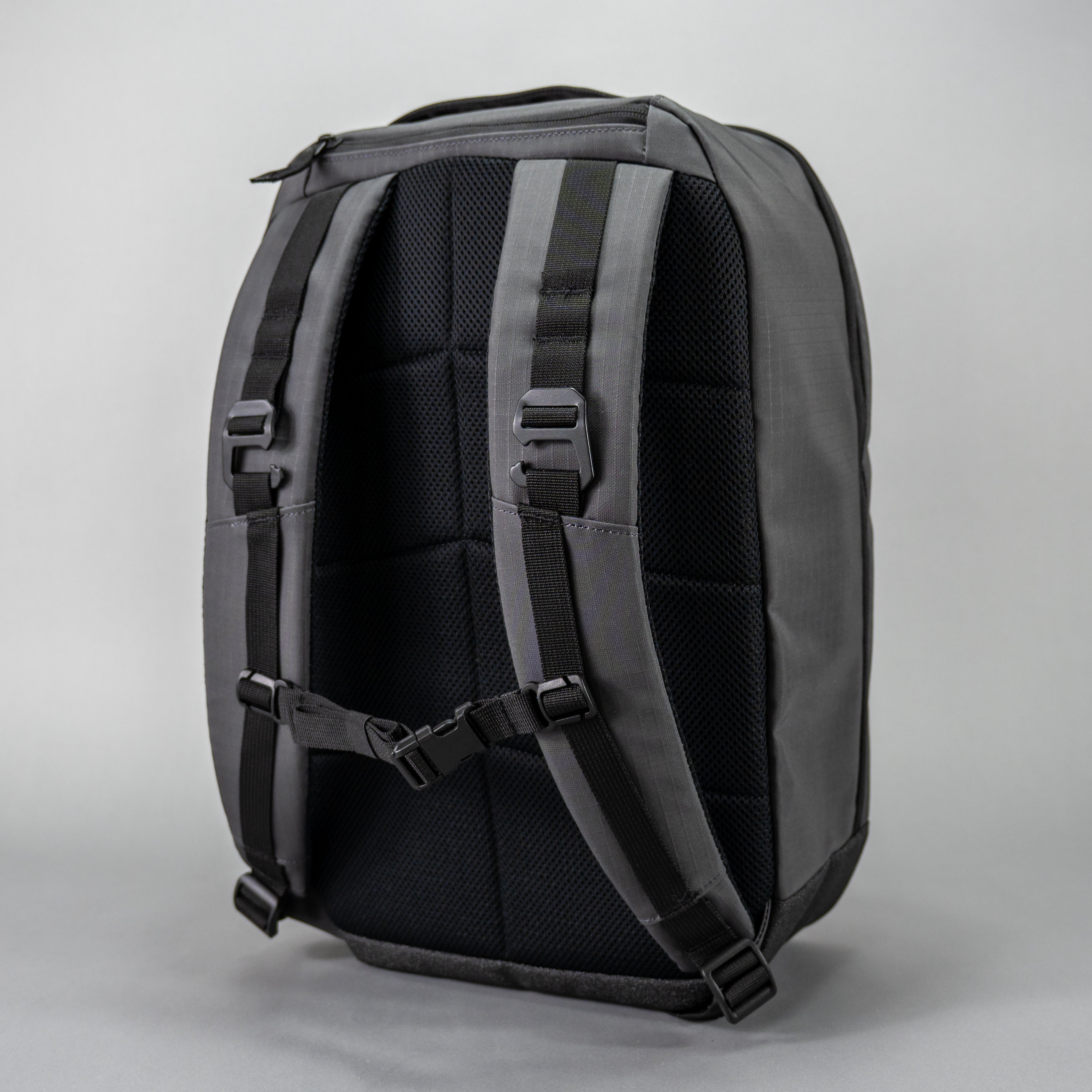 Back of a gray backpack.