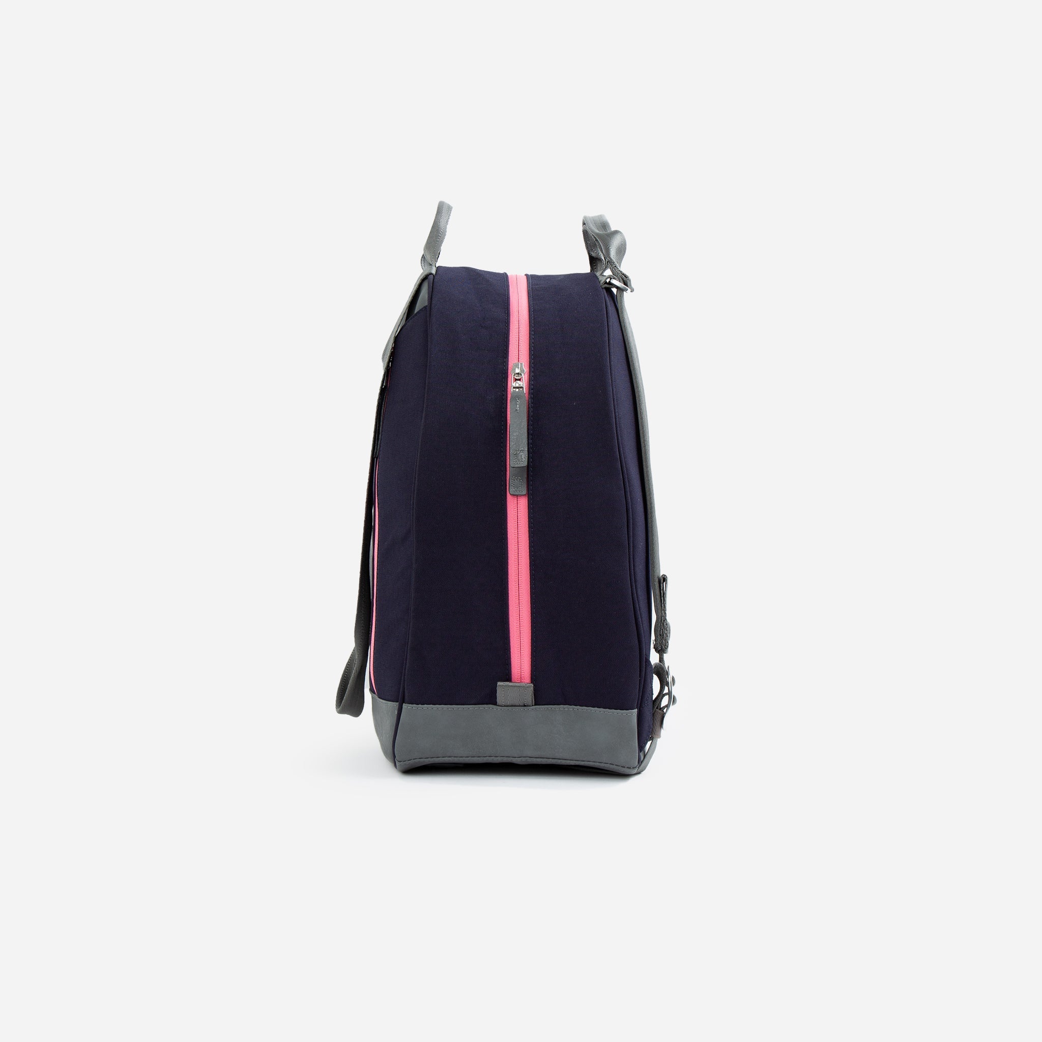 Navy blue tennis backpack and tote by Doubletake with grey trim and a bright pink vertical zipper, side view.