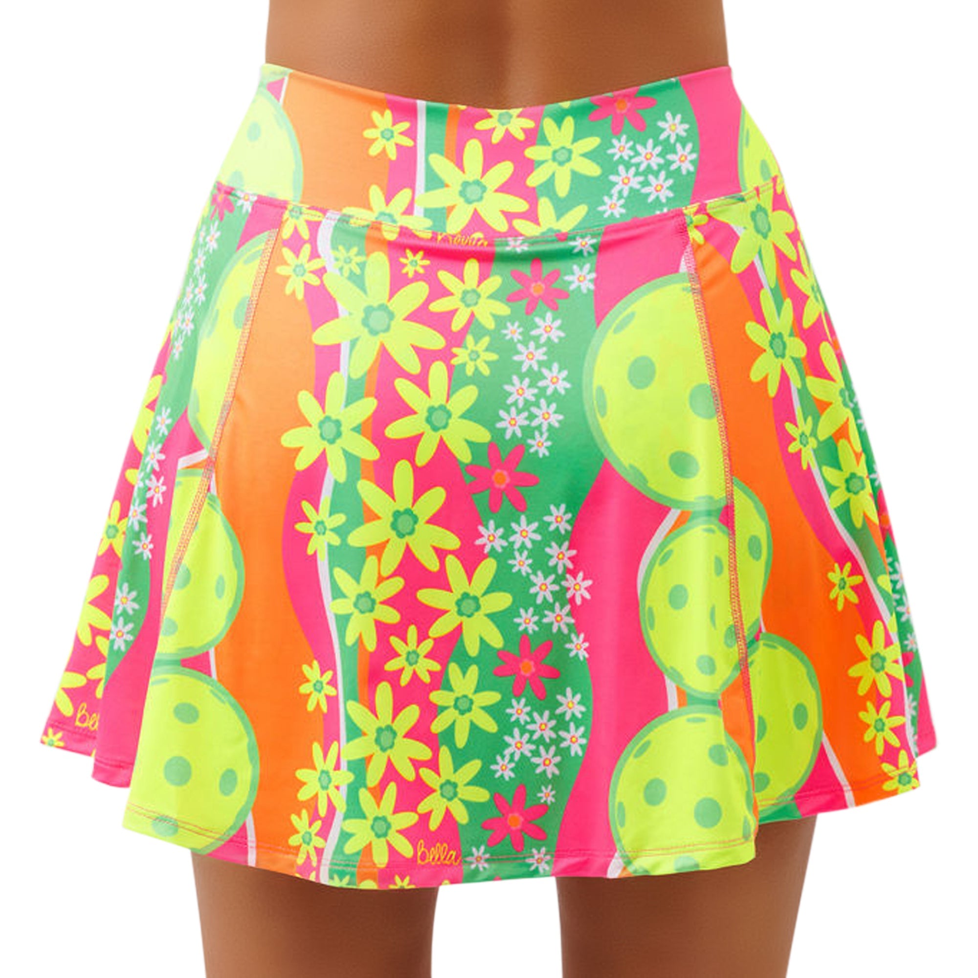 A-line skort in a vibrant daisy and pickleball pattern by Pickleball Bella, featuring bright pink, green, orange, and yellow hues.