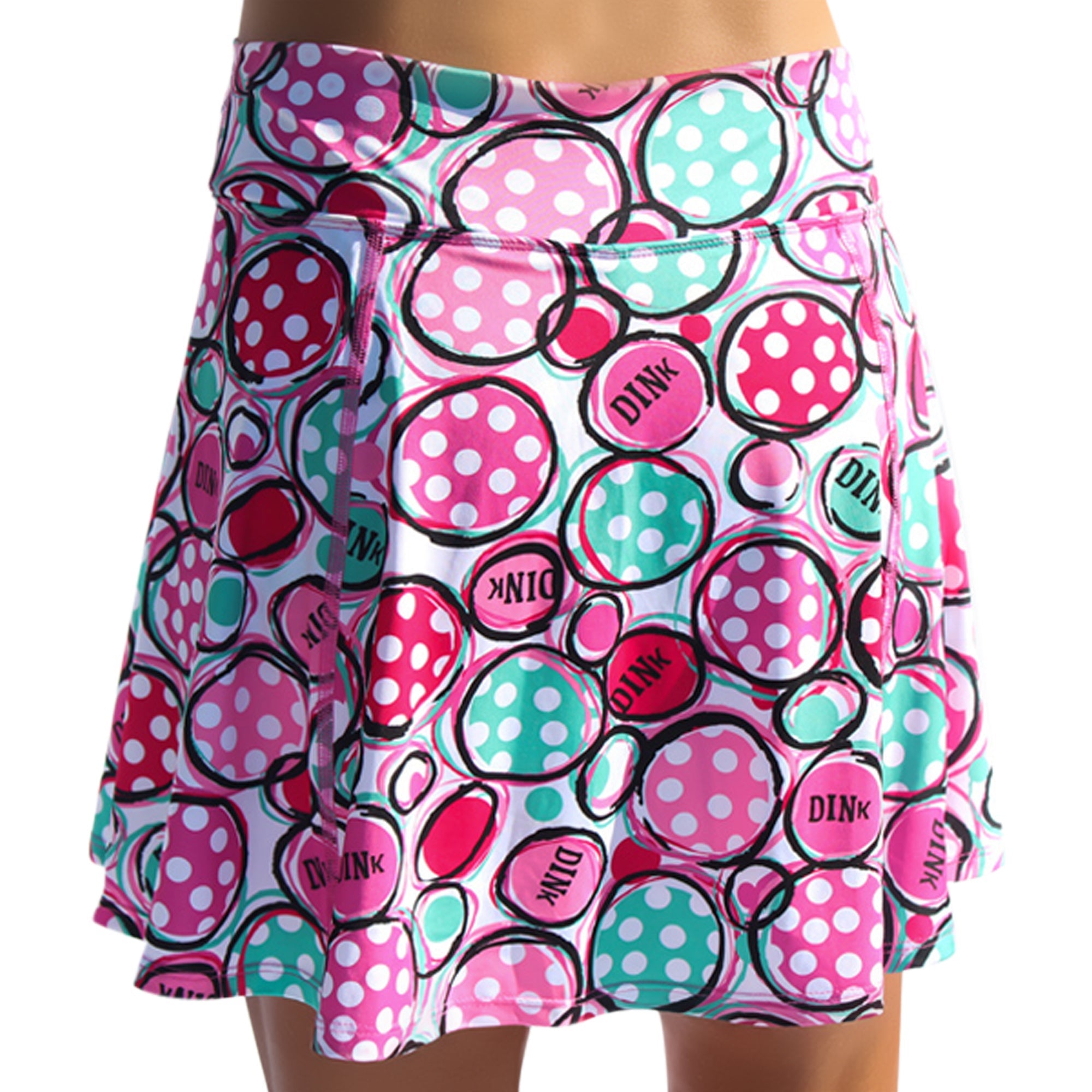 A pink, teal, and red polka dot A-Line Skort by Pickleball Bella featuring "DINK" text and black outlined circles.