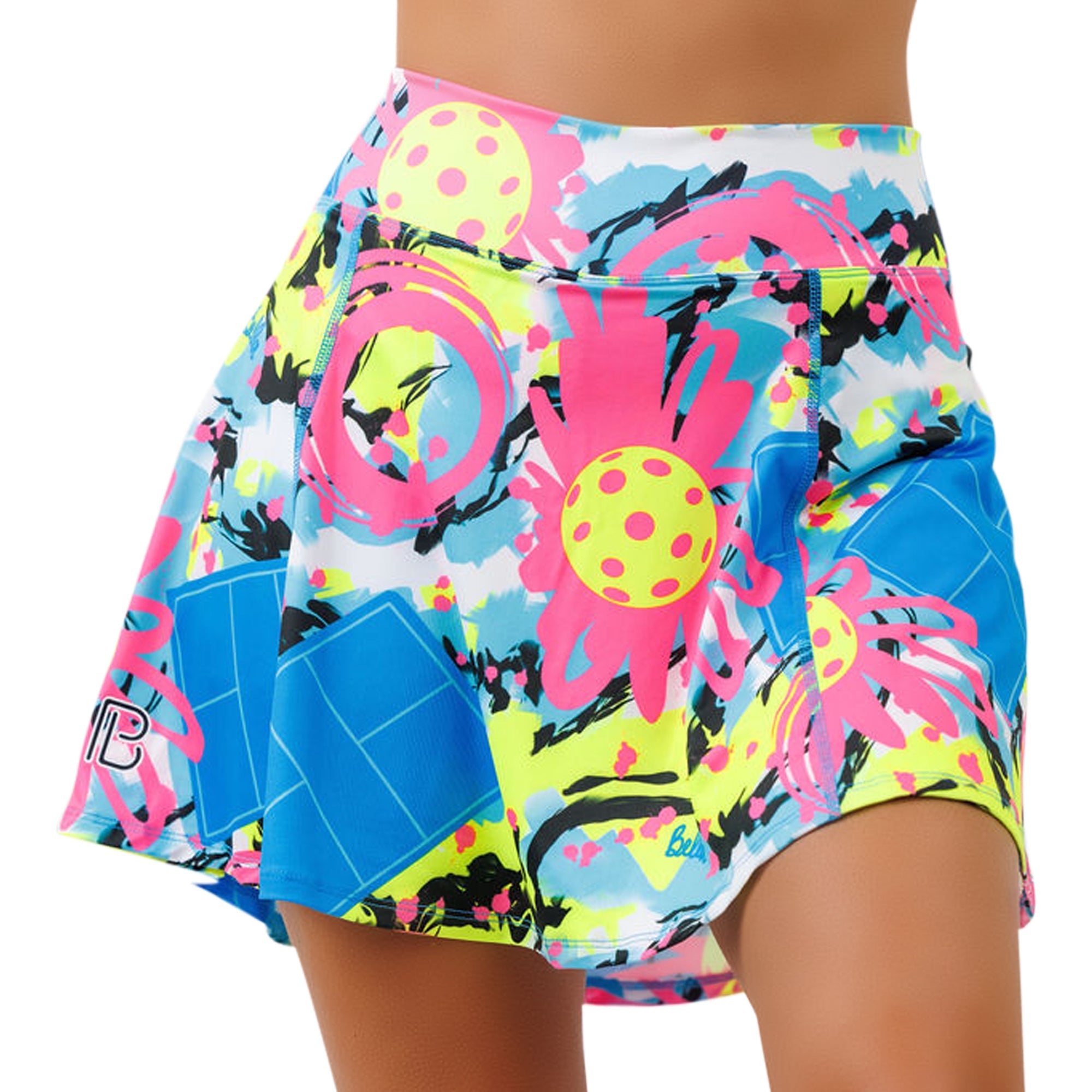 Vibrant neon multi-color A-line skort by Pickleball Bella, featuring abstract pickleball courts and balls, worn by a model.