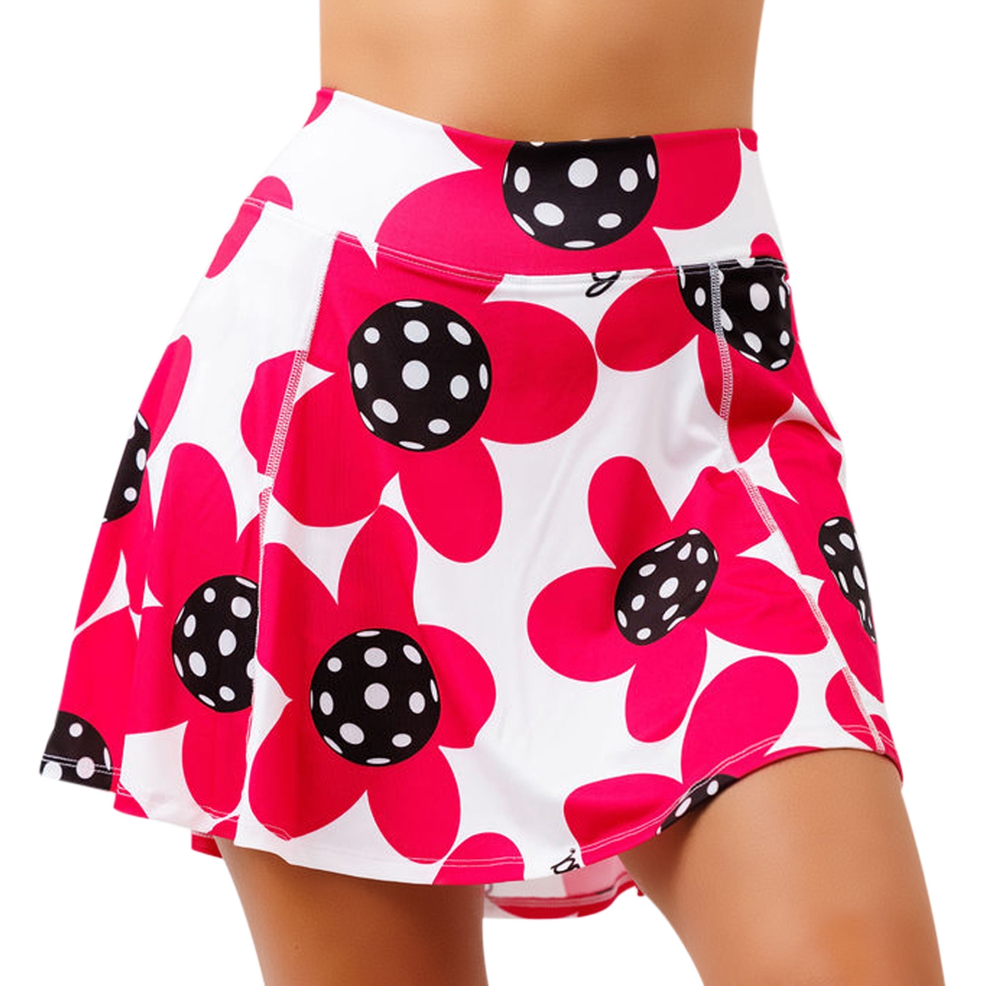 White and magenta poppy A-Line skort by Pickleball Bella, featuring black polka-dotted centers.