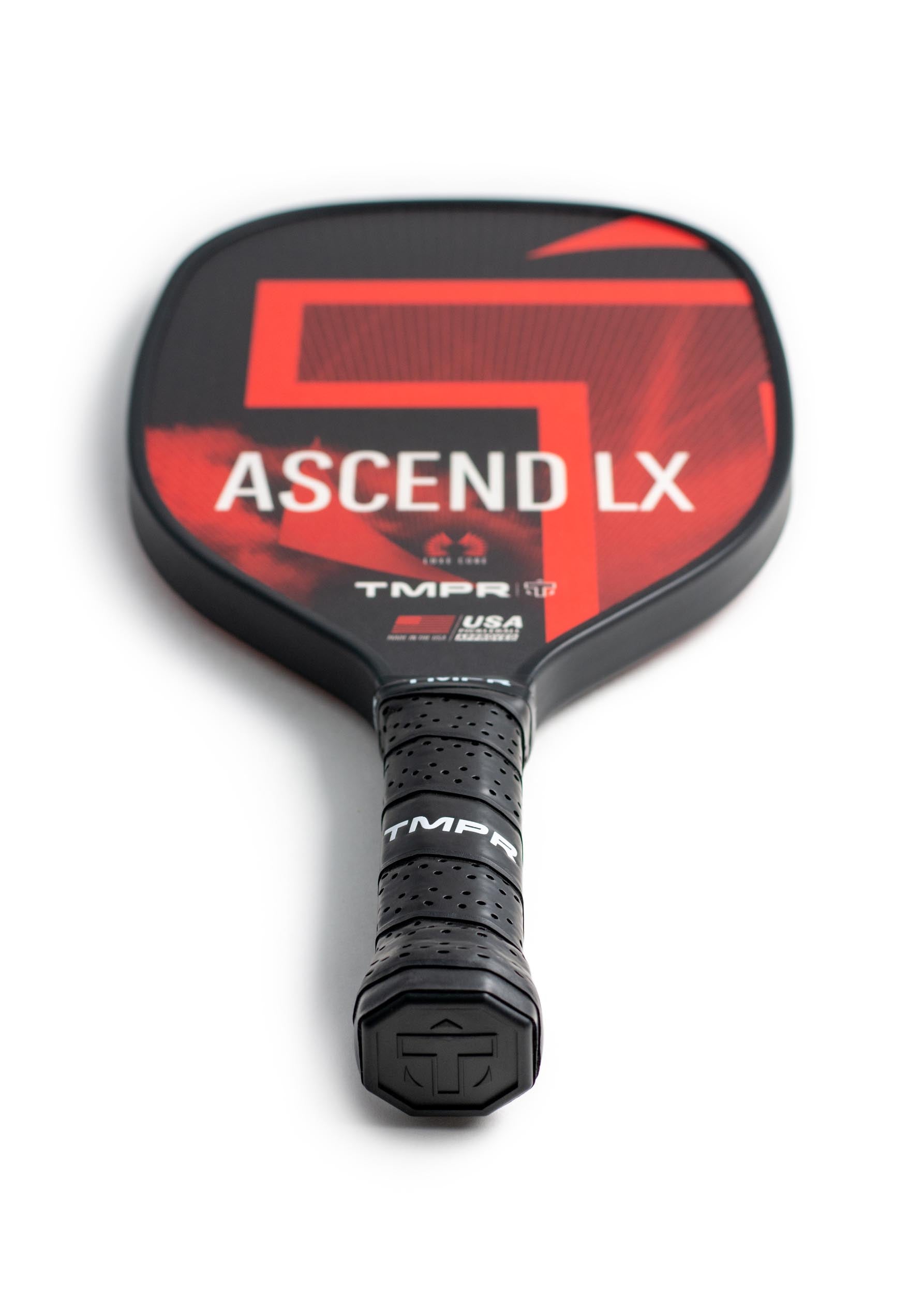 Black and red pickleball paddle by TMPR Sports, featuring 'ASCEND LX' and geometric patterns, with a black perforated grip.
