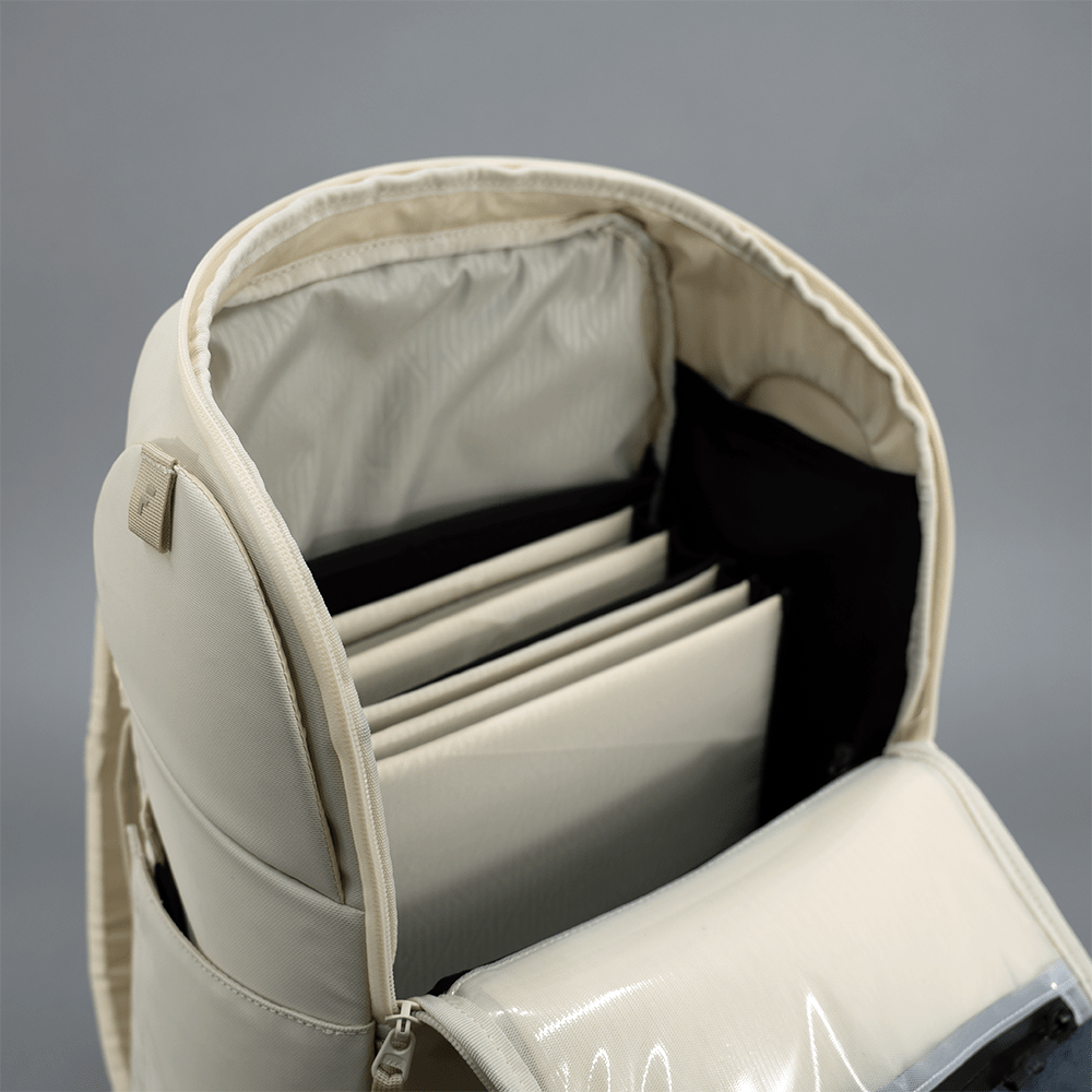 Light gray Court Caddy Pickleball Bag by FORWRD, open showing multiple organized compartments and a clear zippered pocket.