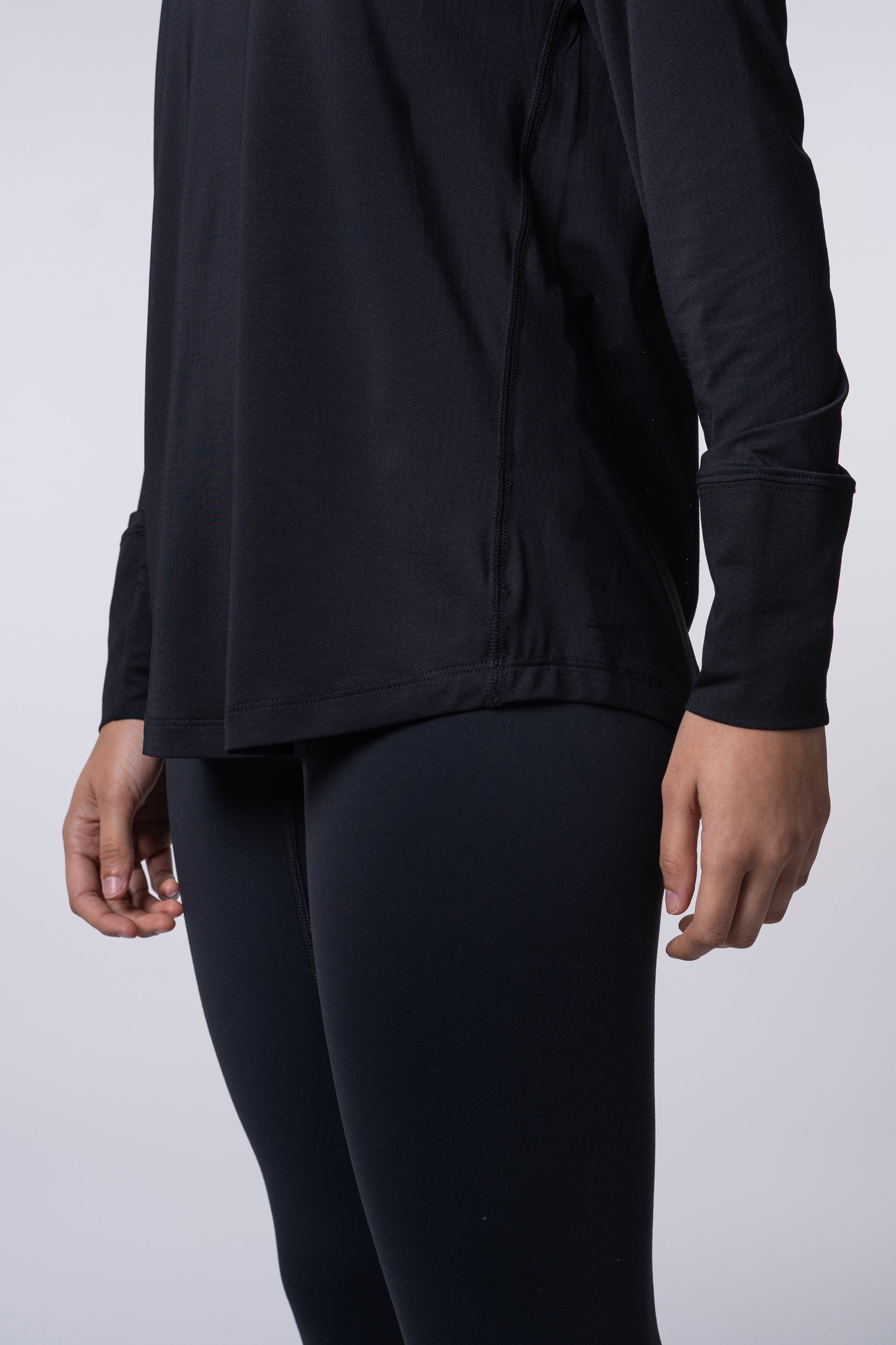 Person in black athletic wear.