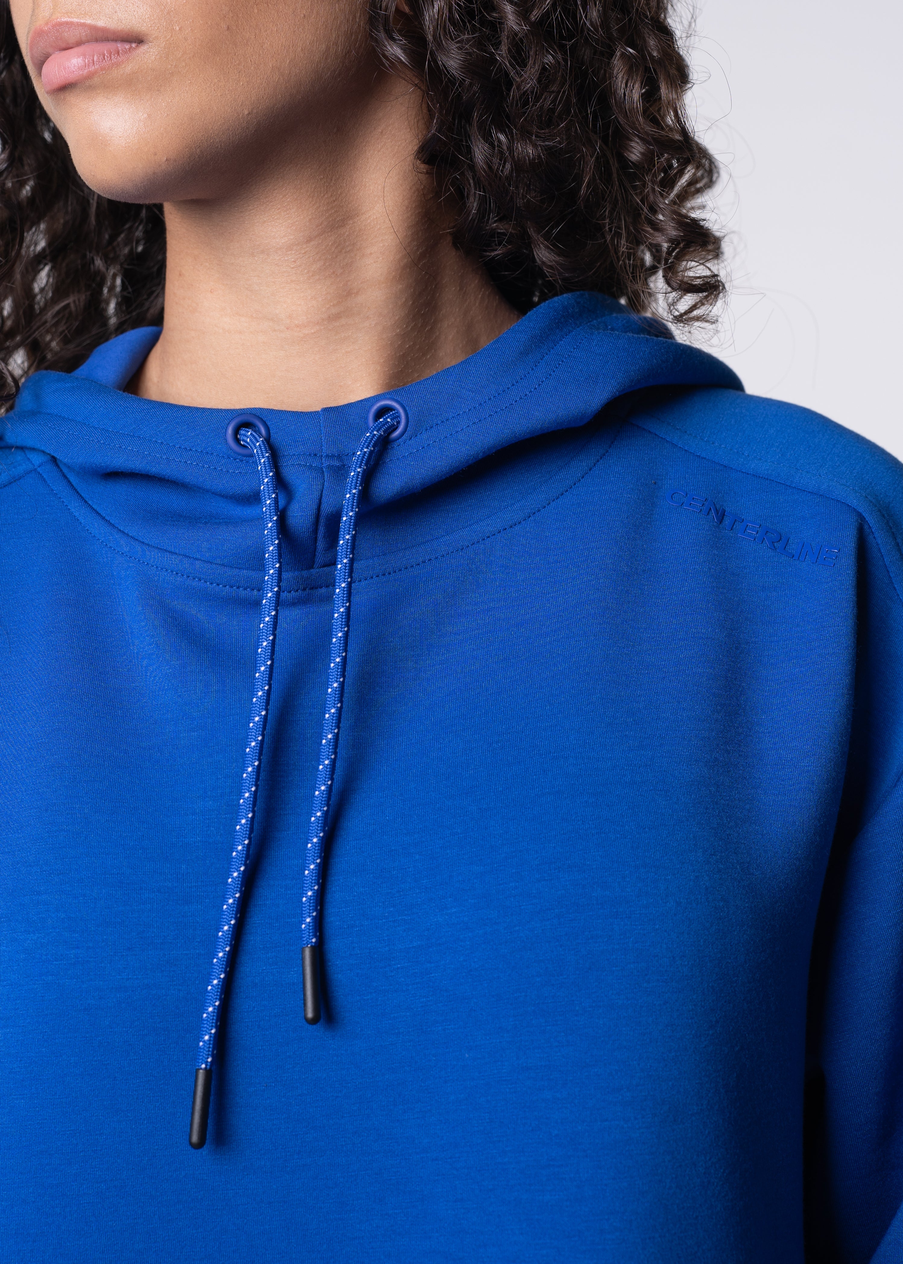 Woman in blue hoodie.