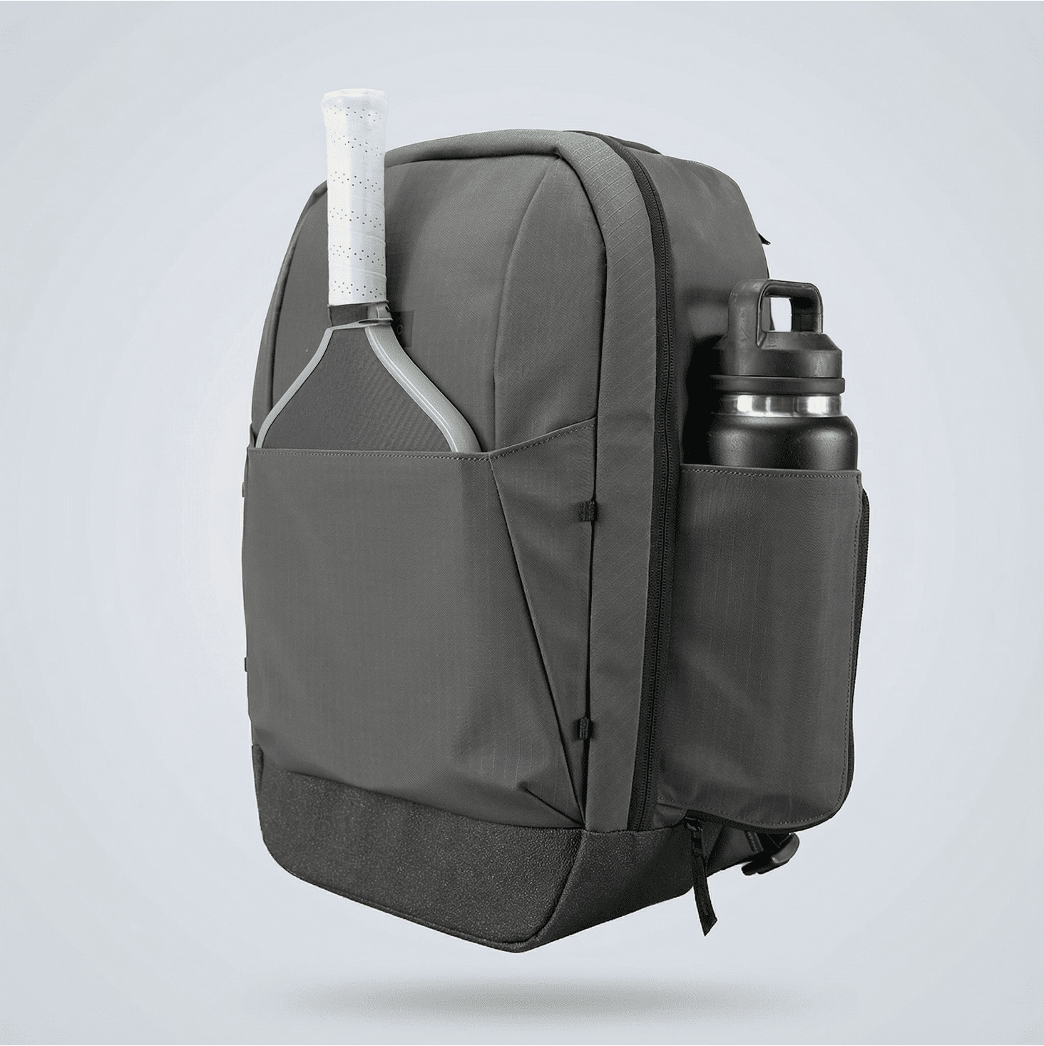 Dark gray Court Ranger Pickleball Backpack by FORWRD, front-facing, with a pickleball paddle and water bottle in side pockets.