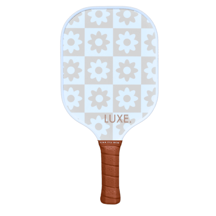 Pickleball paddle with a floral pattern and brown handle.