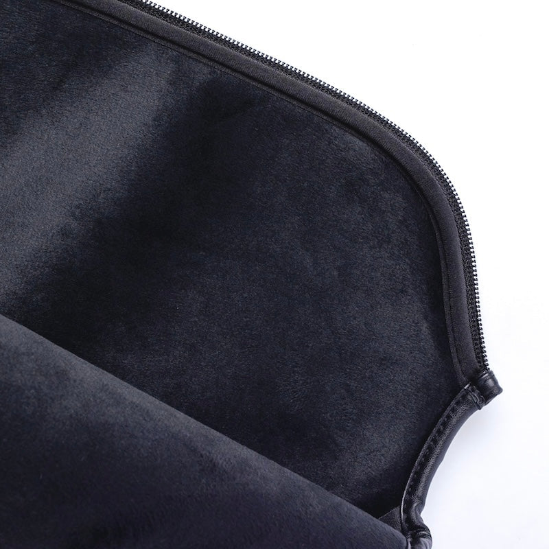 Black velvet zippered bag.
