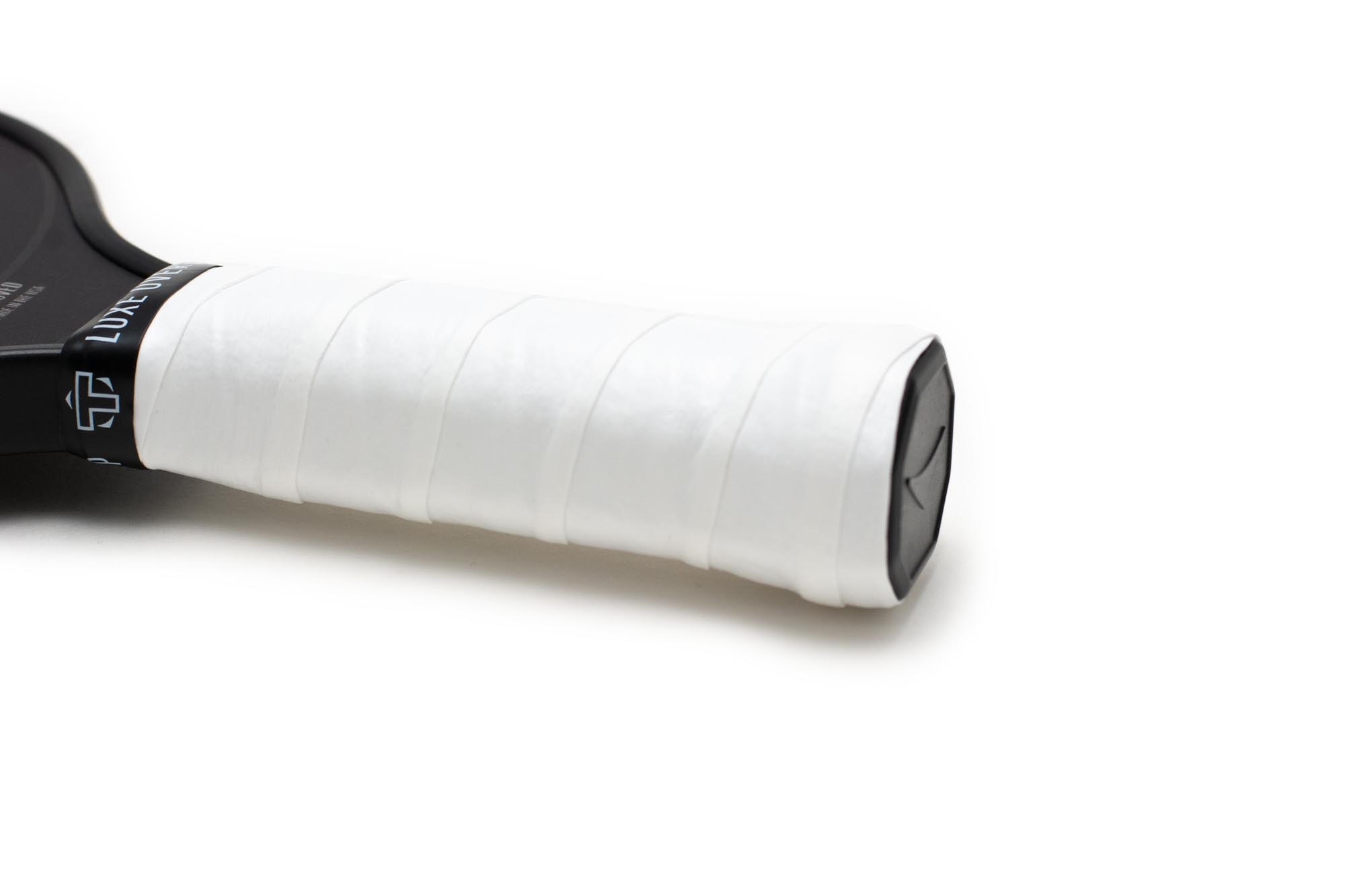 White overgrip by TMPR Sports, wrapped around a black paddle handle, featuring the brand's 'Luxe' text and logo.