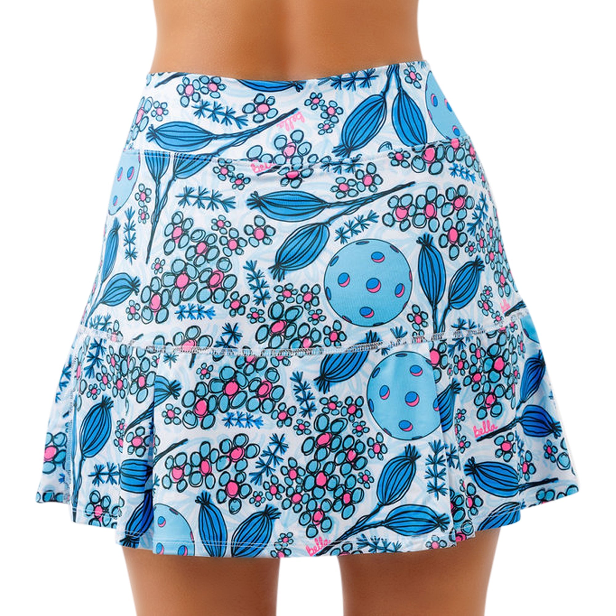 White drop pleat skort by Pickleball Bella, patterned with blue seed pods, pink and blue flowers, and light blue pickleballs, back view.