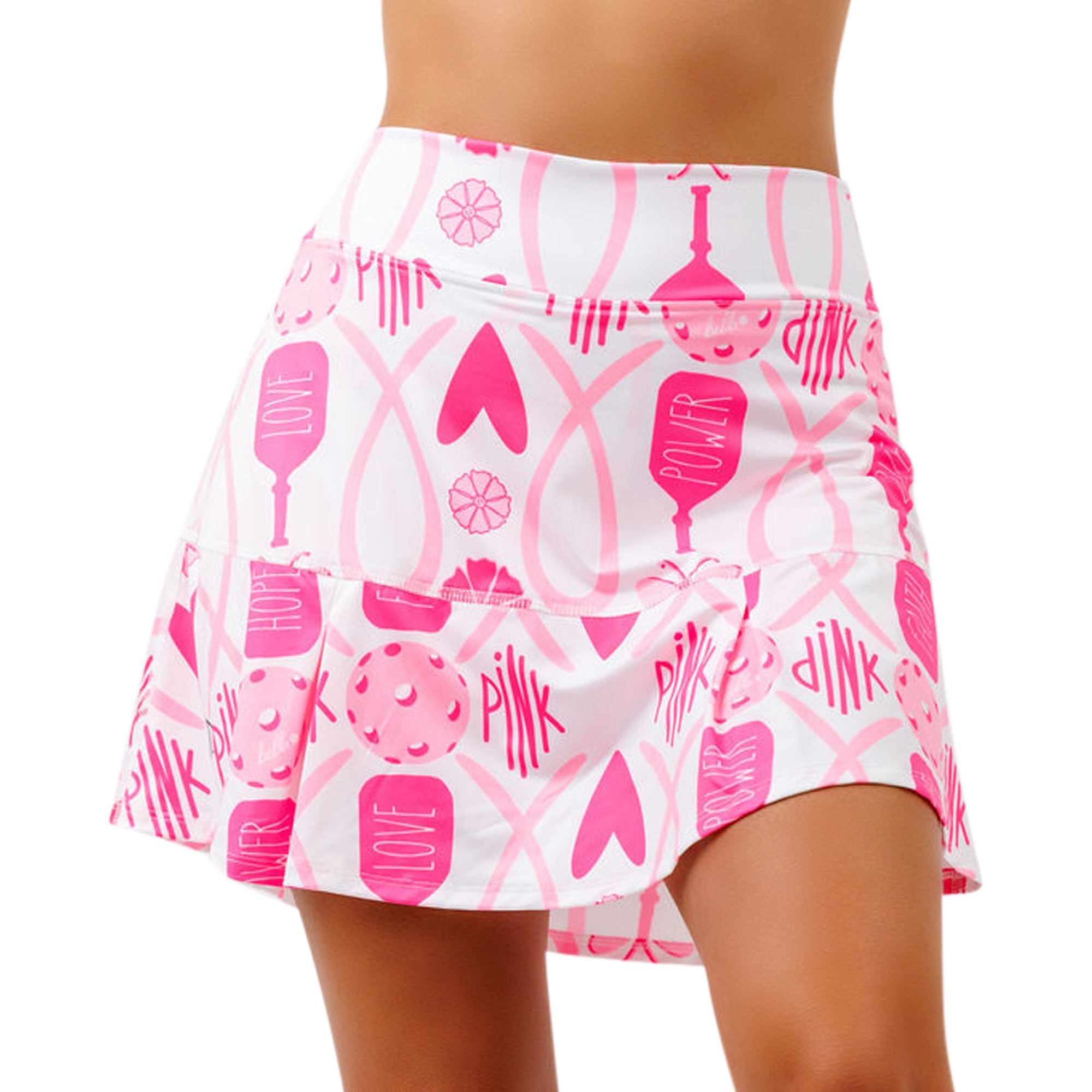 White and pink drop pleat skort by Pickleball Bella, featuring a pickleball-themed pattern with paddles, balls, and words 'LOVE,' 'HOPE,' 'POWER,' 'PINK'.