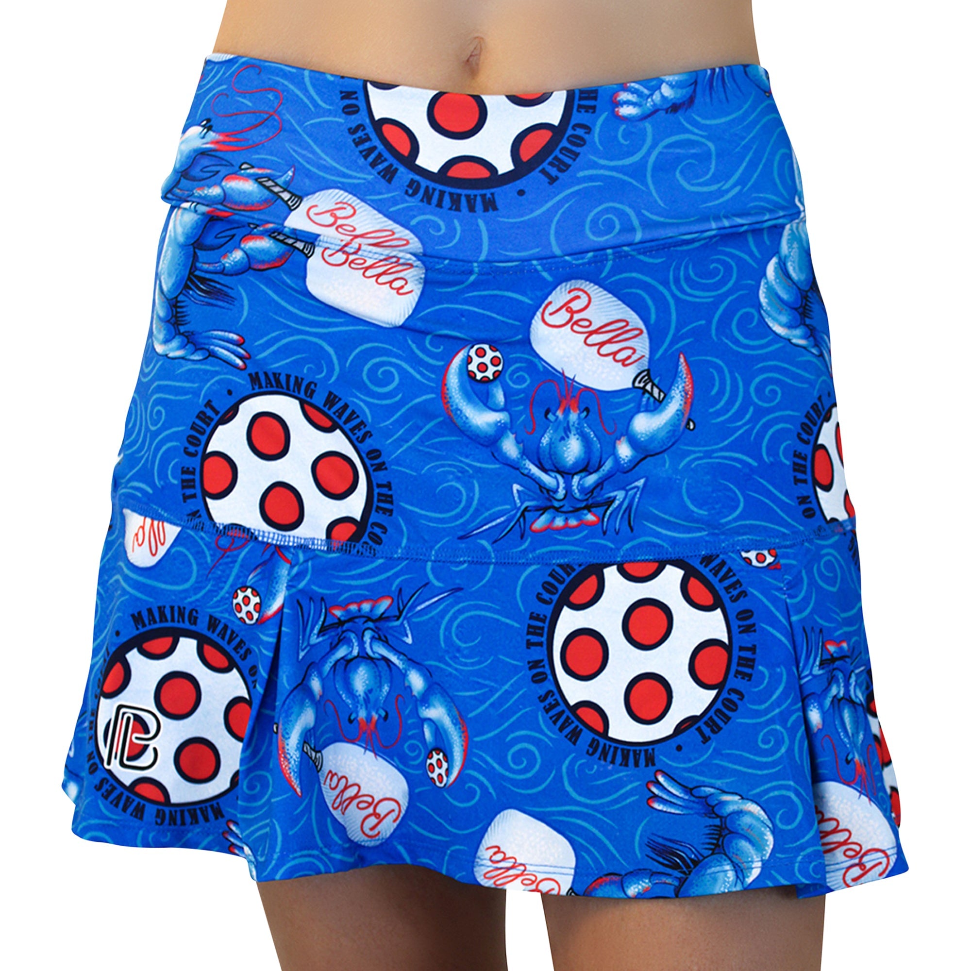 Blue pleat skort by Pickleball Bella, patterned with lobsters, pickleball paddles, and 'Making Waves On The Court' text.