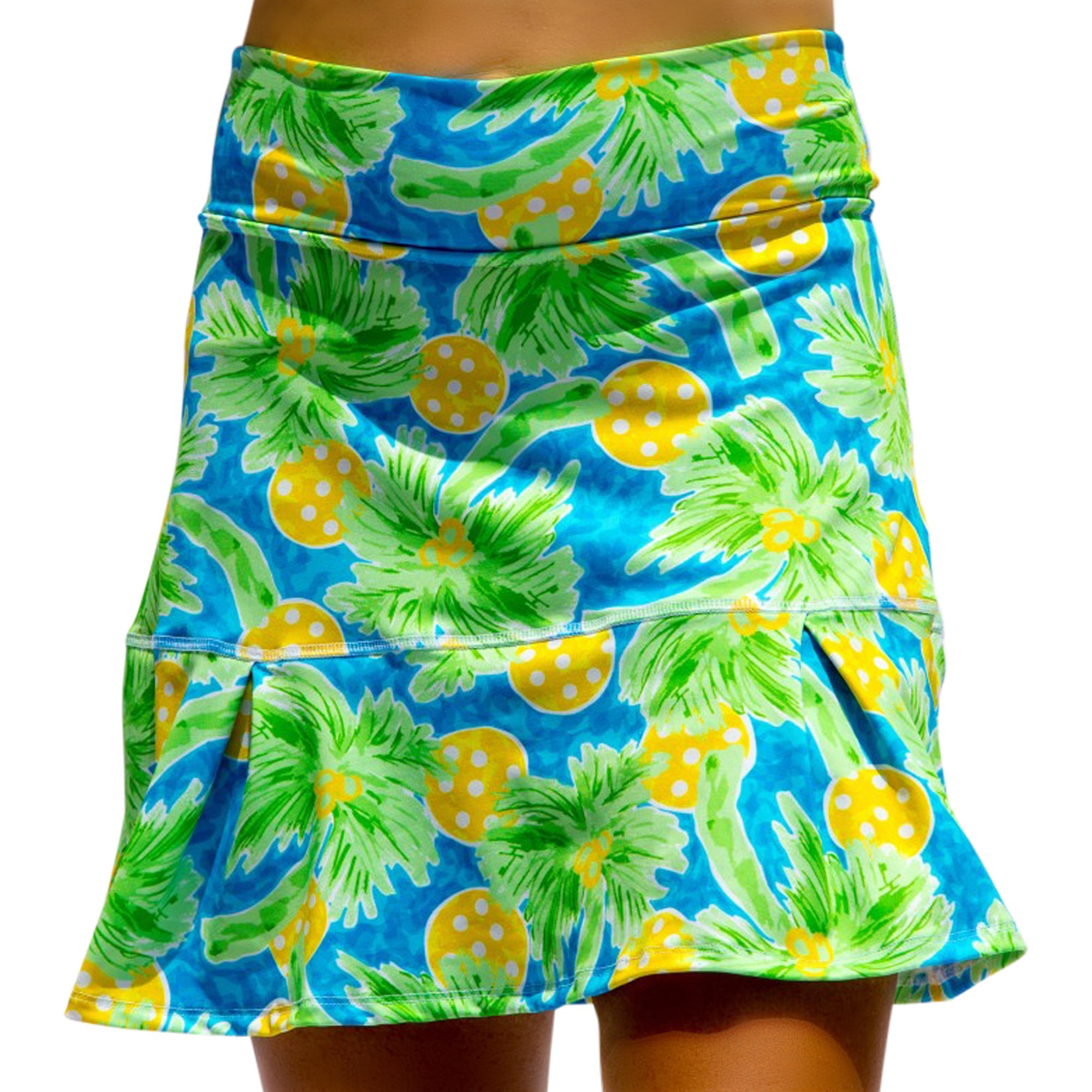 Vibrant tropical blue and green drop pleat skort by Pickleball Bella, with a palm and polka-dotted fruit pattern.