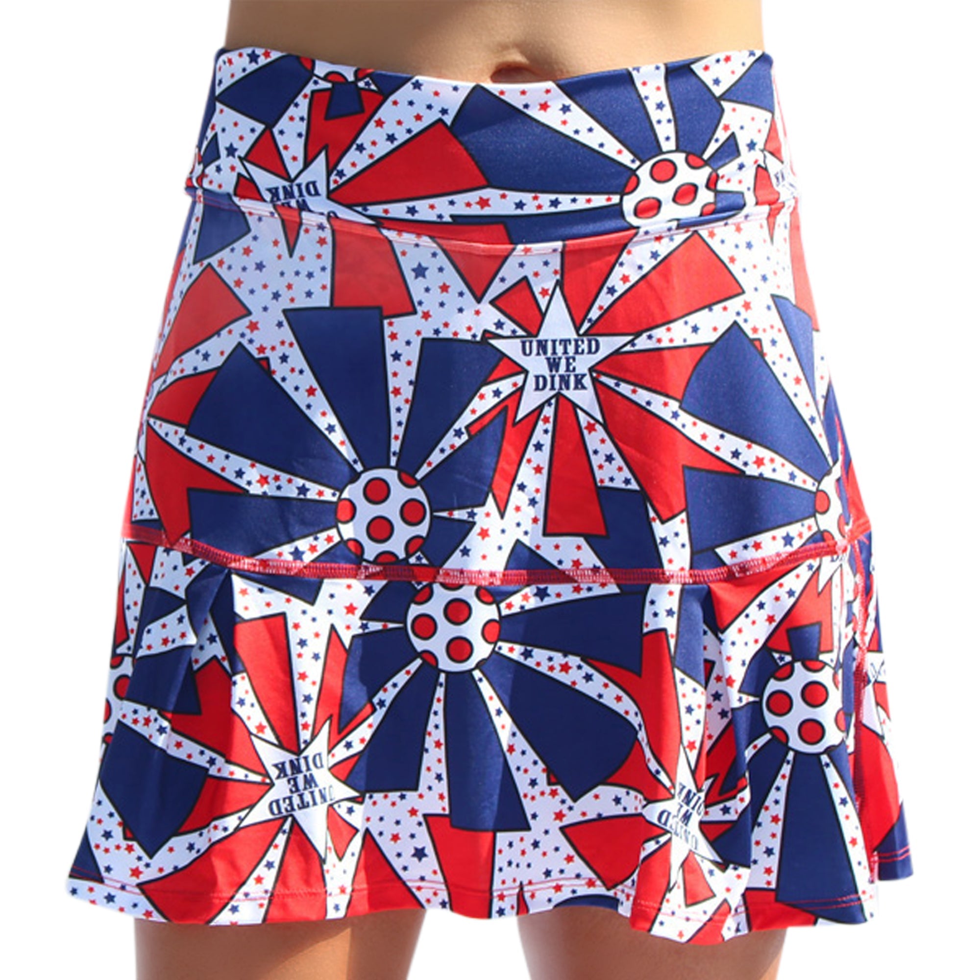 Red, white, and blue drop pleat skort by Pickleball Bella, with patriotic stars and 'UNITED WE DINK' text.
