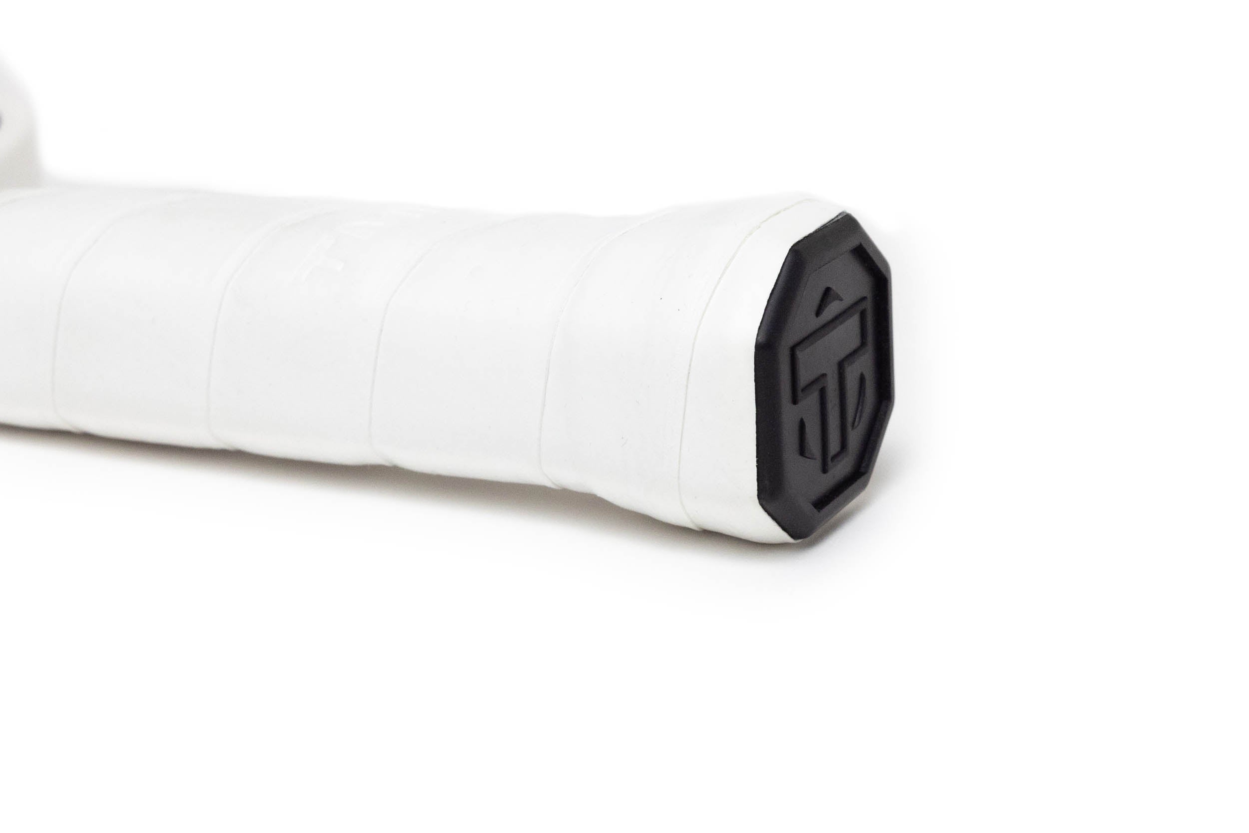 White handle of a Pickleball Paddle by TMPR Sports, with a black octagonal end cap featuring a raised 'T' logo.