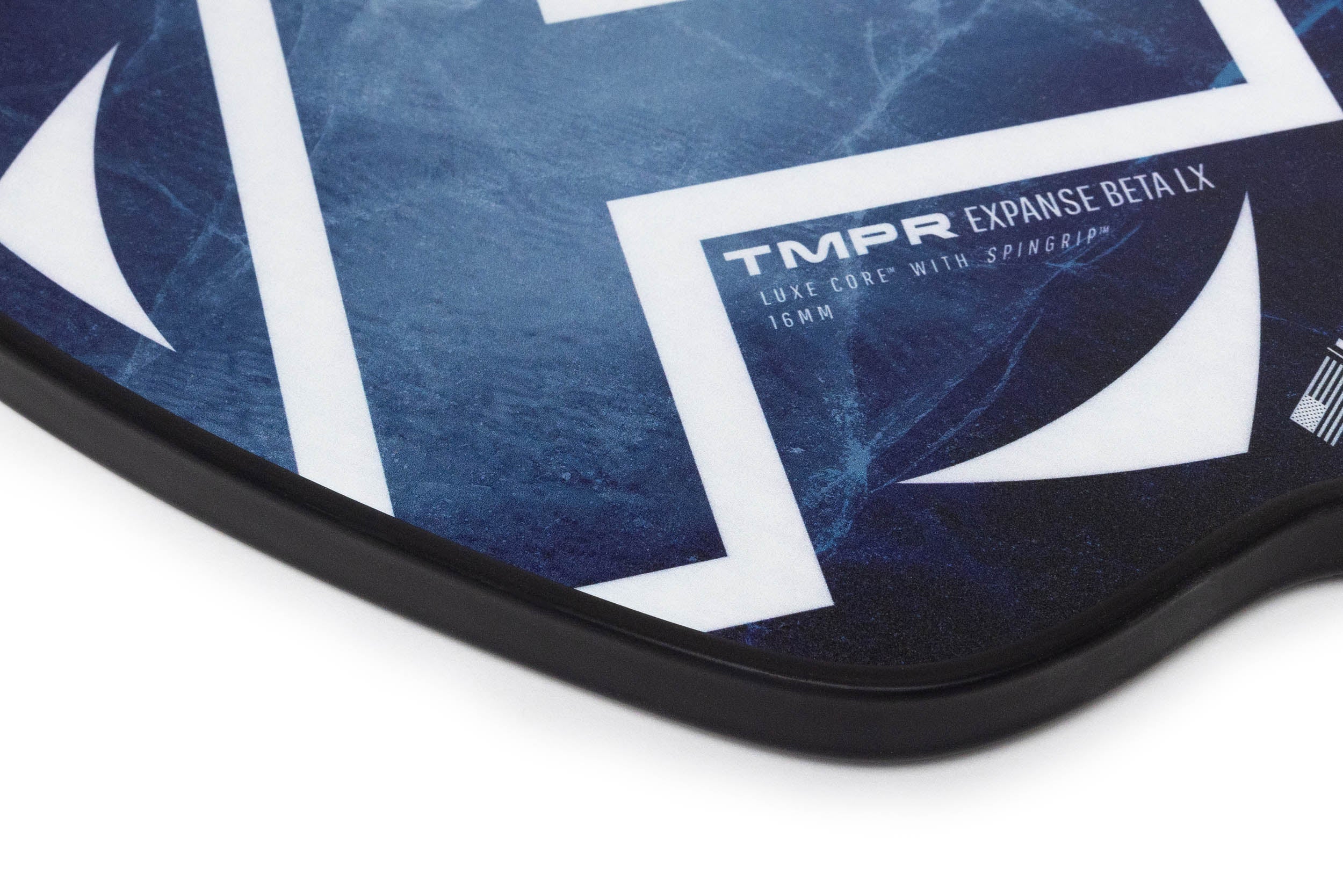 Indigo Ice pickleball paddle by TMPR Sports with blue marble pattern, white geometric design, and black edge.