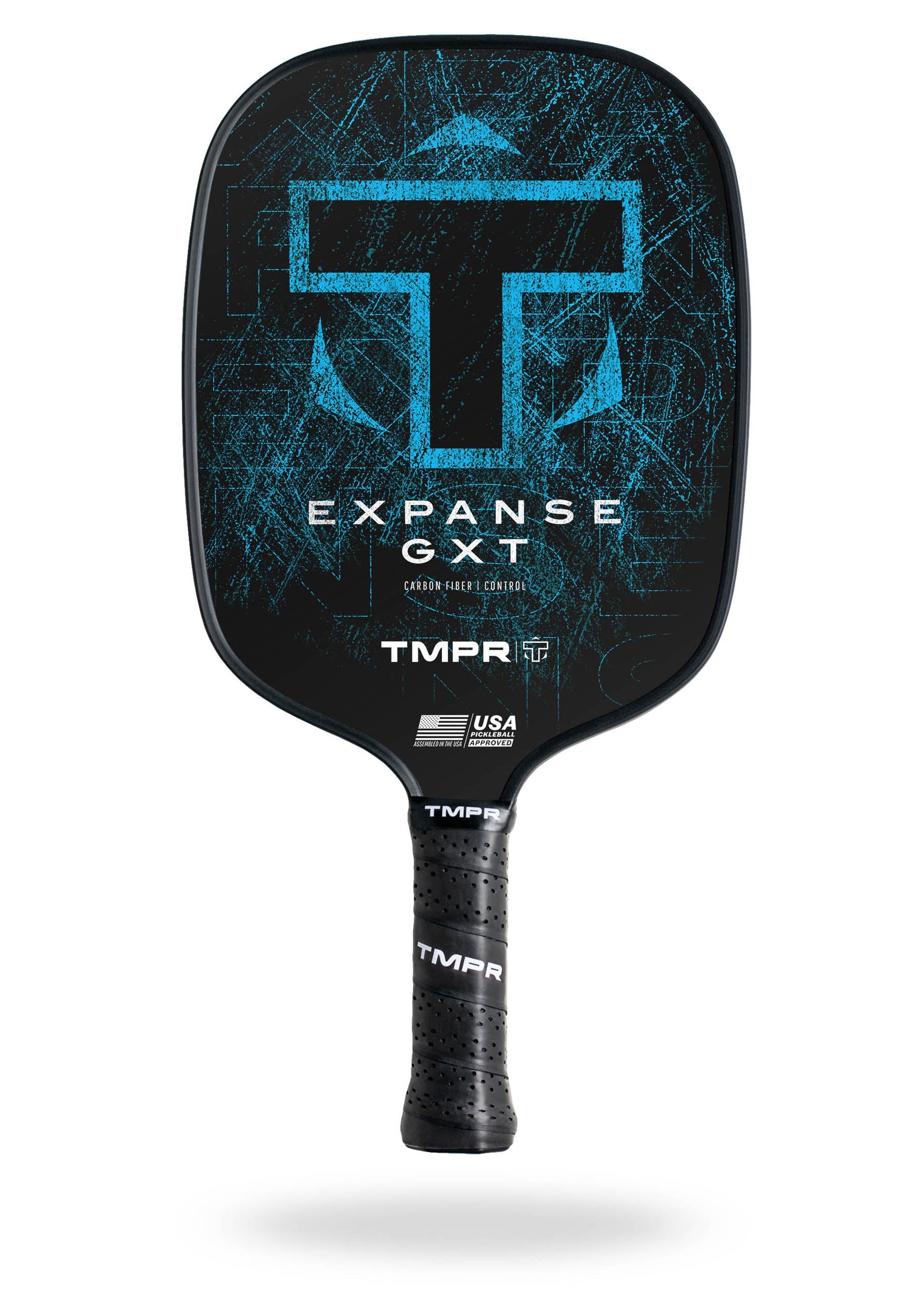 Black carbon fiber pickleball paddle by TMPR Sports, with a distressed blue geometric pattern, white 'EXPANSE GXT' text, and a perforated grip.