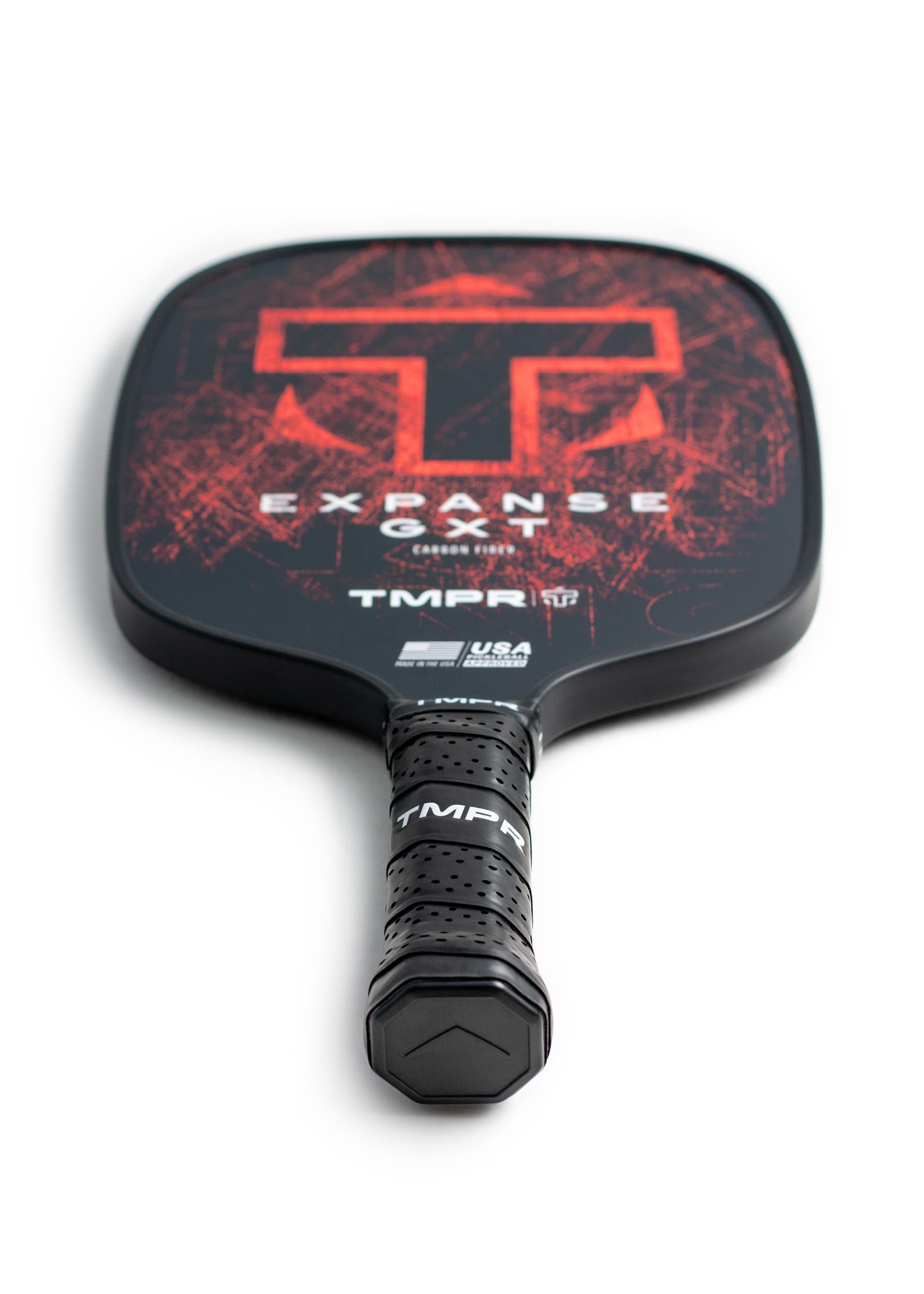 Dark gray Expanse GXT pickleball paddle by TMPR Sports, featuring distressed red graphics and a black perforated grip.