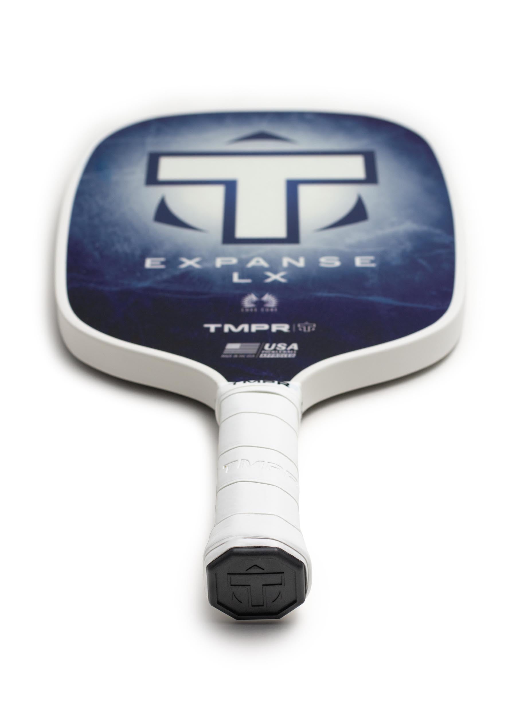 Dark blue patterned pickleball paddle by TMPR Sports with large T logo, white grip, and edge guard.