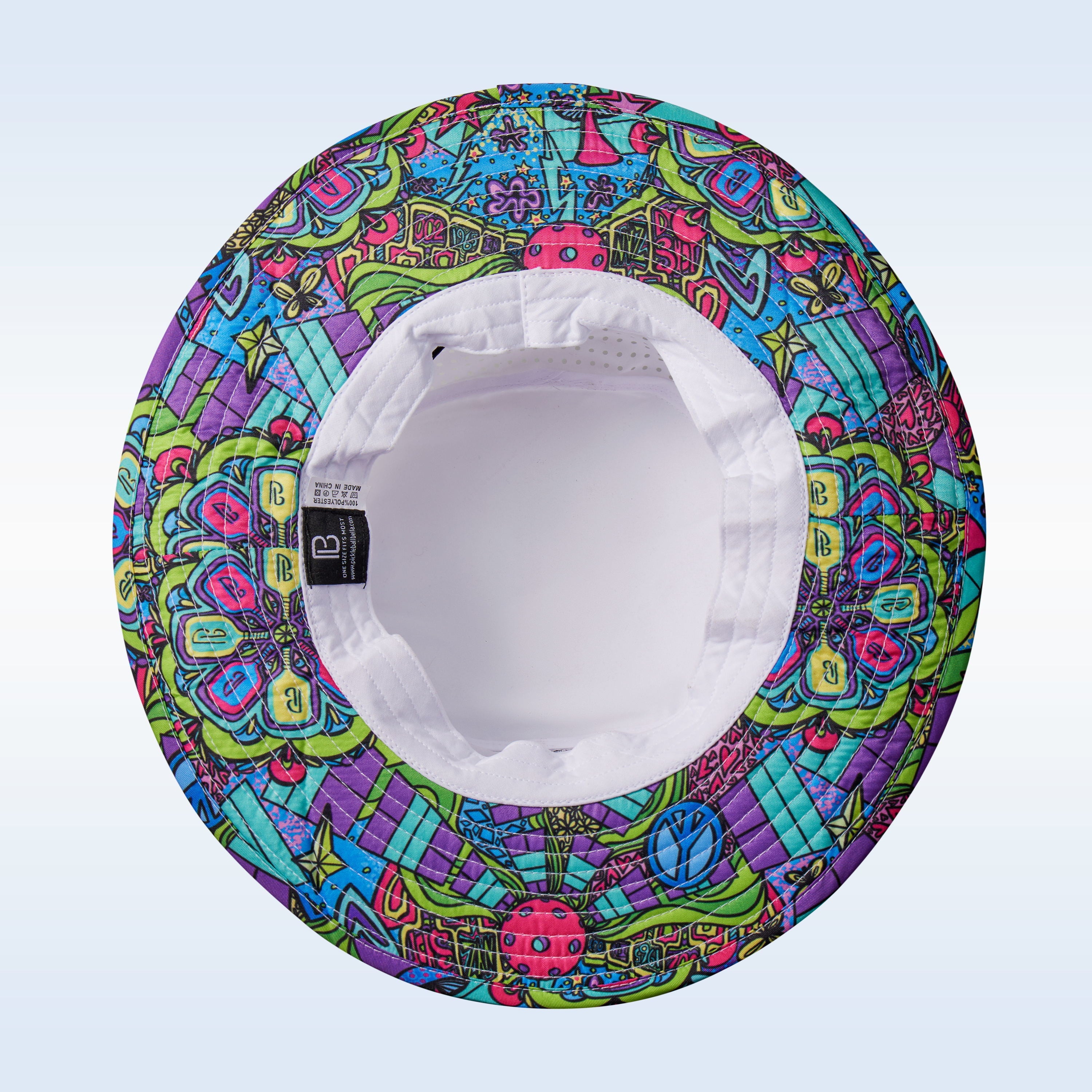 Vibrant, groovy bucket hat by Pickleball Bella, with a psychedelic pattern of peace signs and paddles, shown inside out.