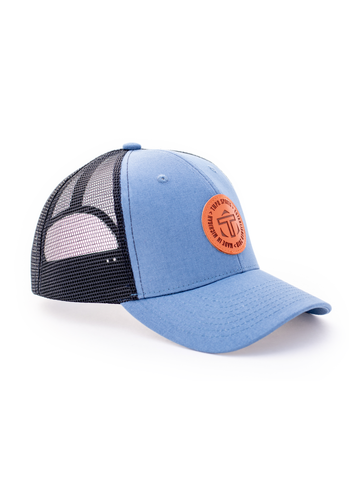 A light blue and black mesh trucker cap by TMPR Sports, featuring a round orange logo patch on the front.