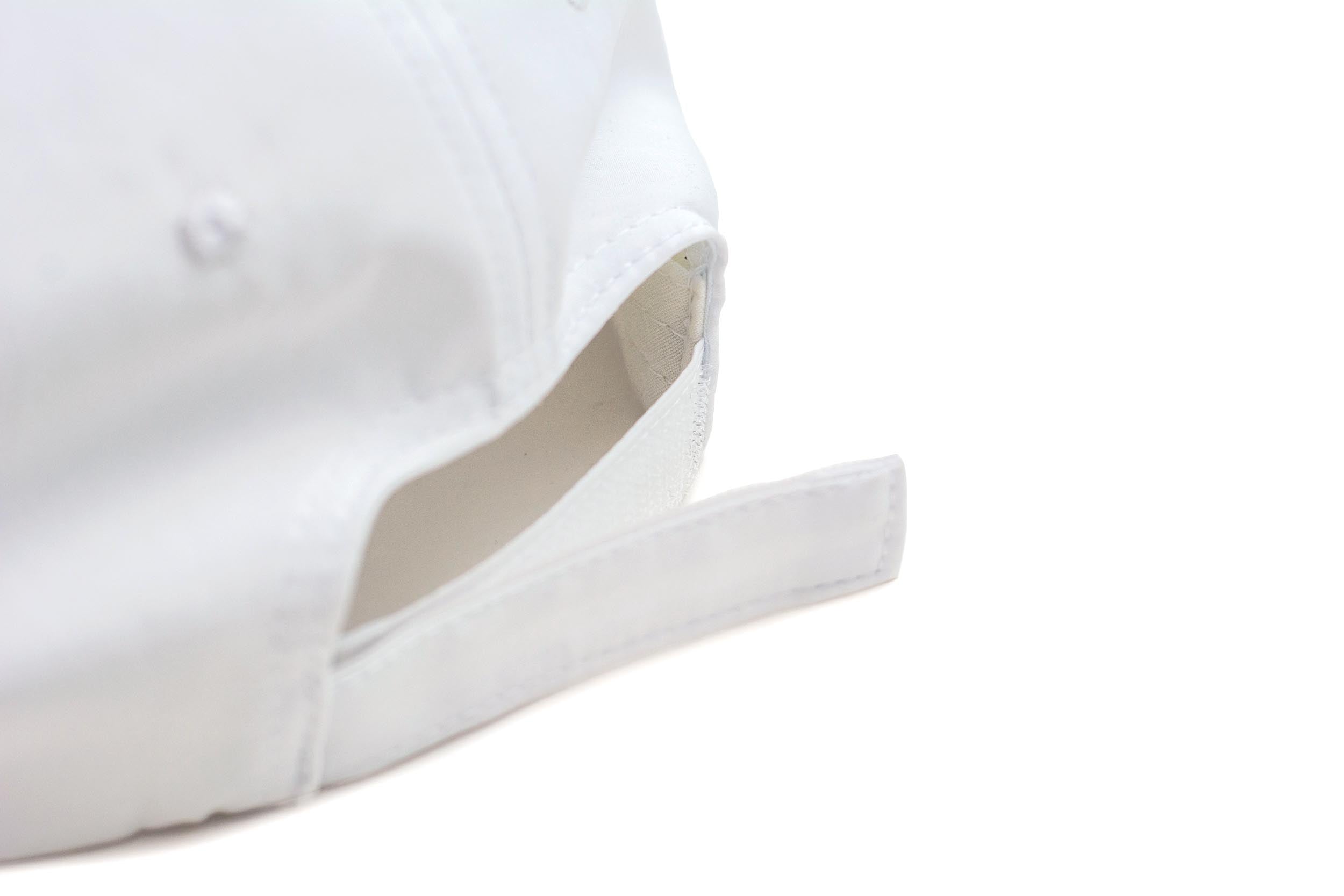 White performance cap by TMPR Sports, shown in a back view featuring an adjustable strap.