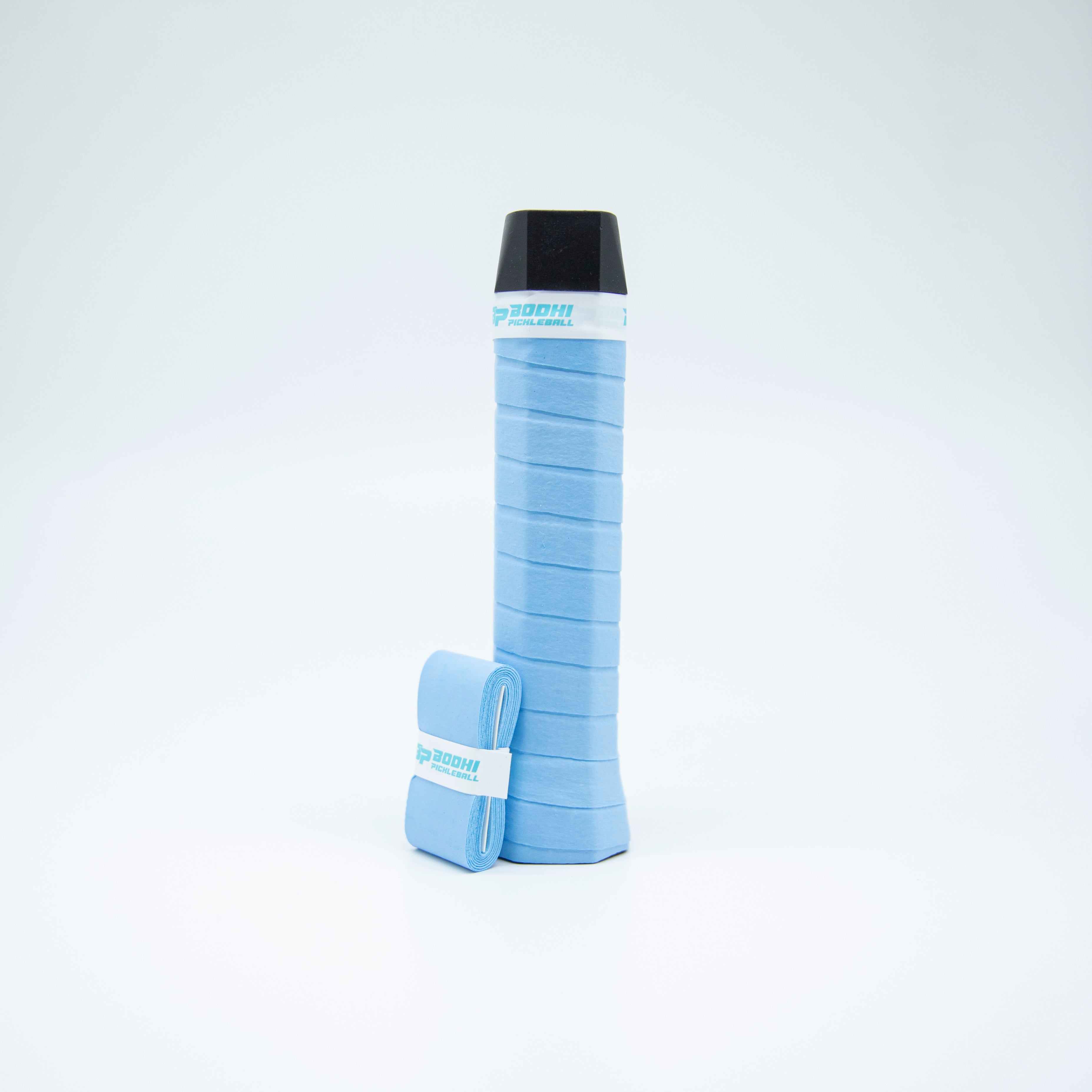 Light blue tennis racket grip with a black cap and matching grip tape roll, isolated on white.