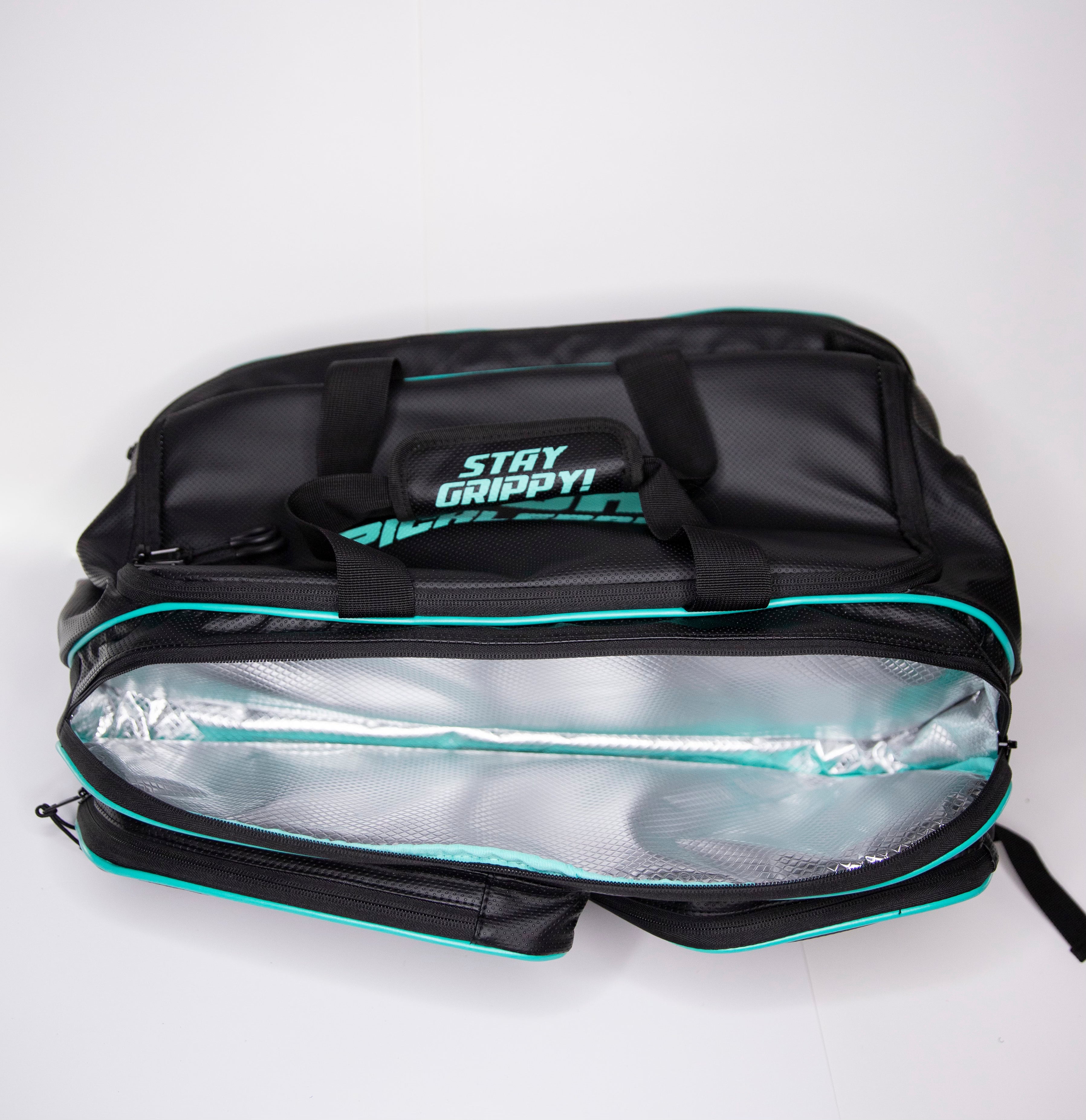 Black and teal "Stay Grippy!" lunch bag, open to show reflective interior.