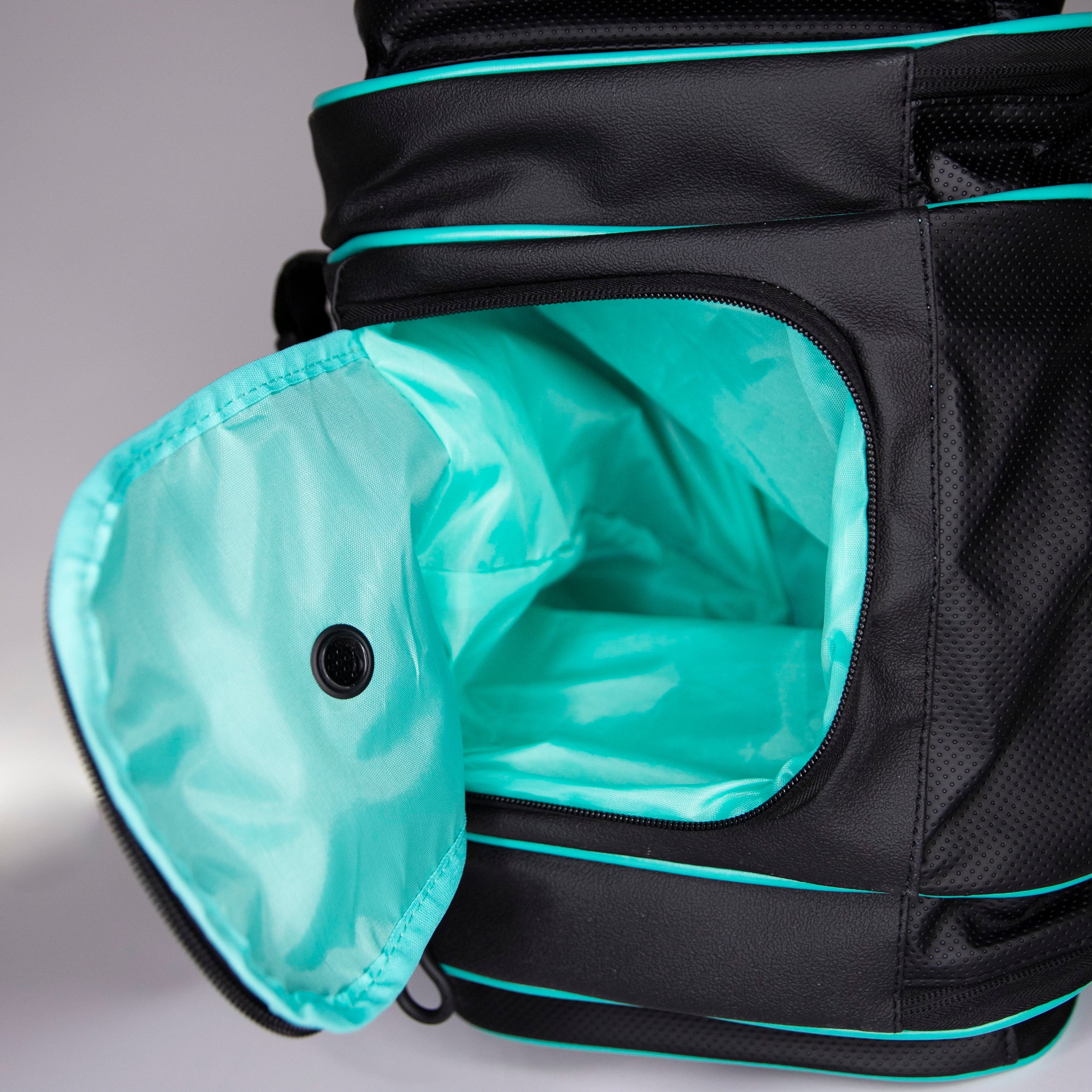 Black and turquoise gym bag with open zippered pocket.