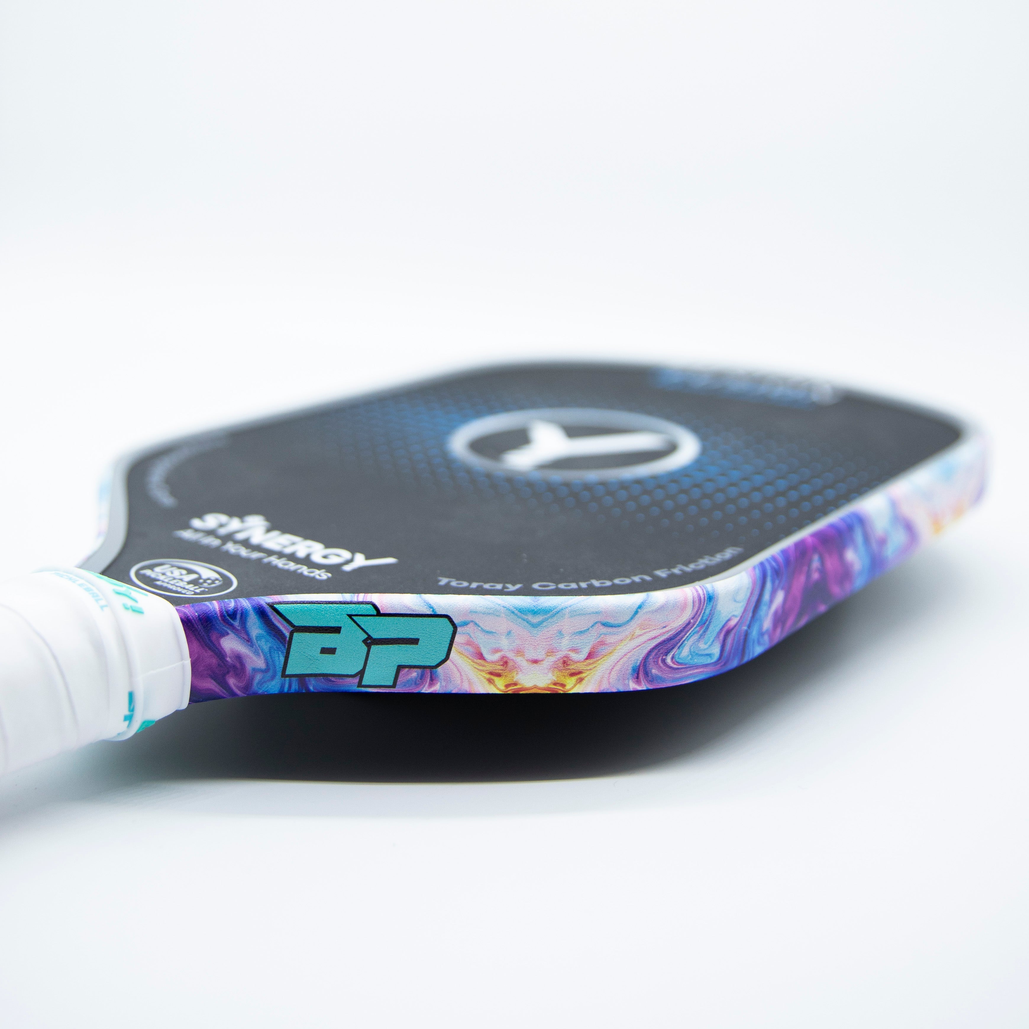 A pickleball paddle with a colorful design.