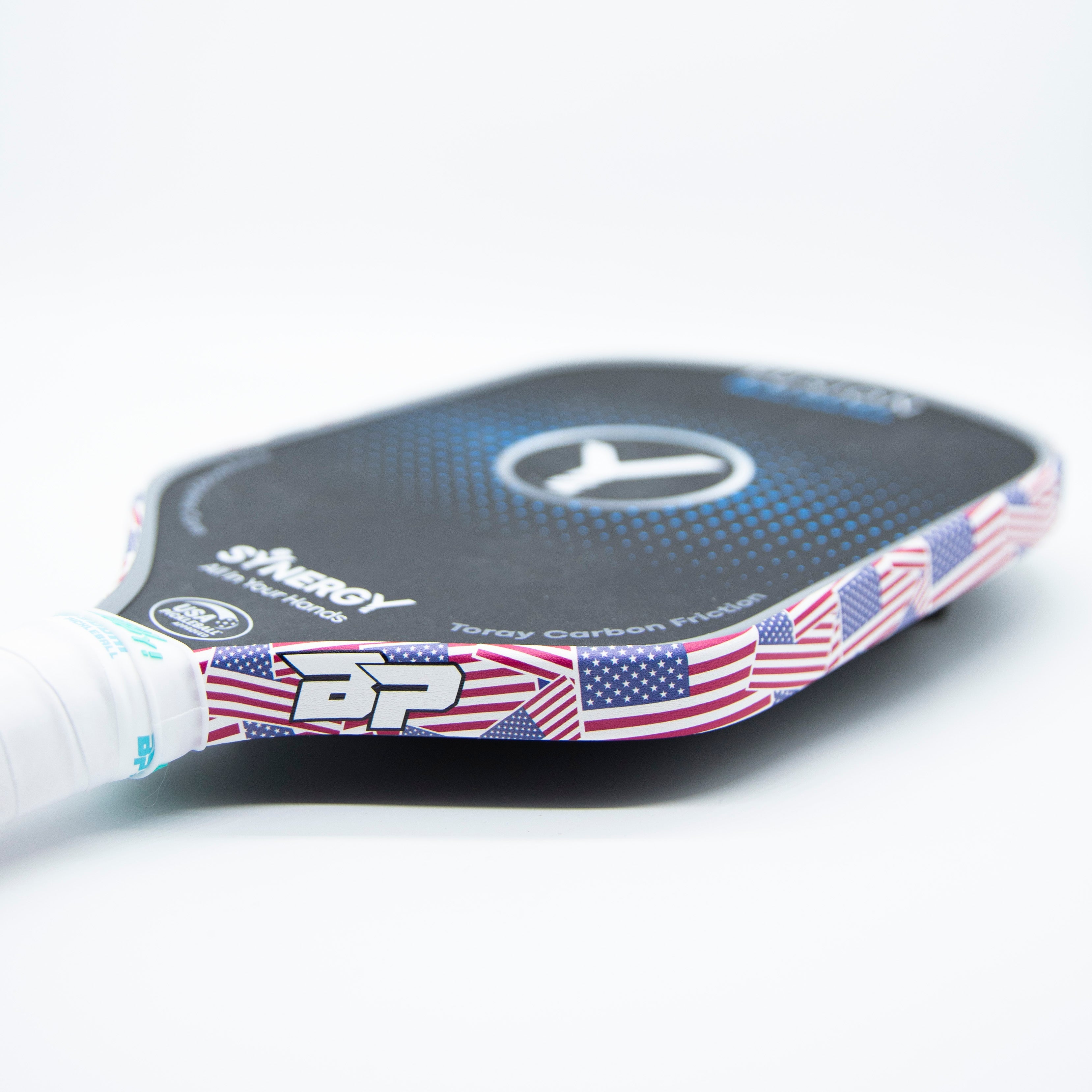 Close-up of a pickleball paddle with an American flag design.