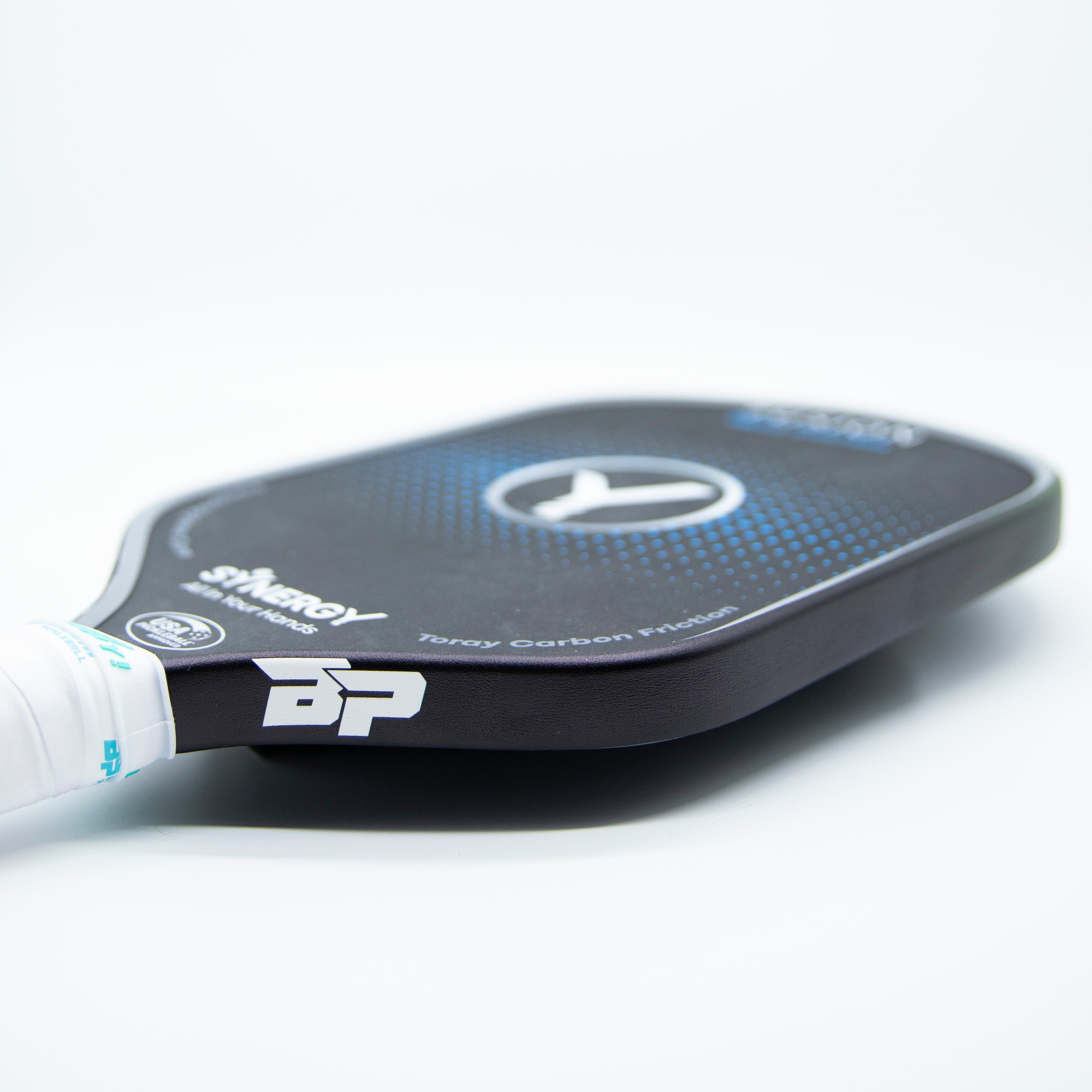 Black pickleball paddle with white grip.