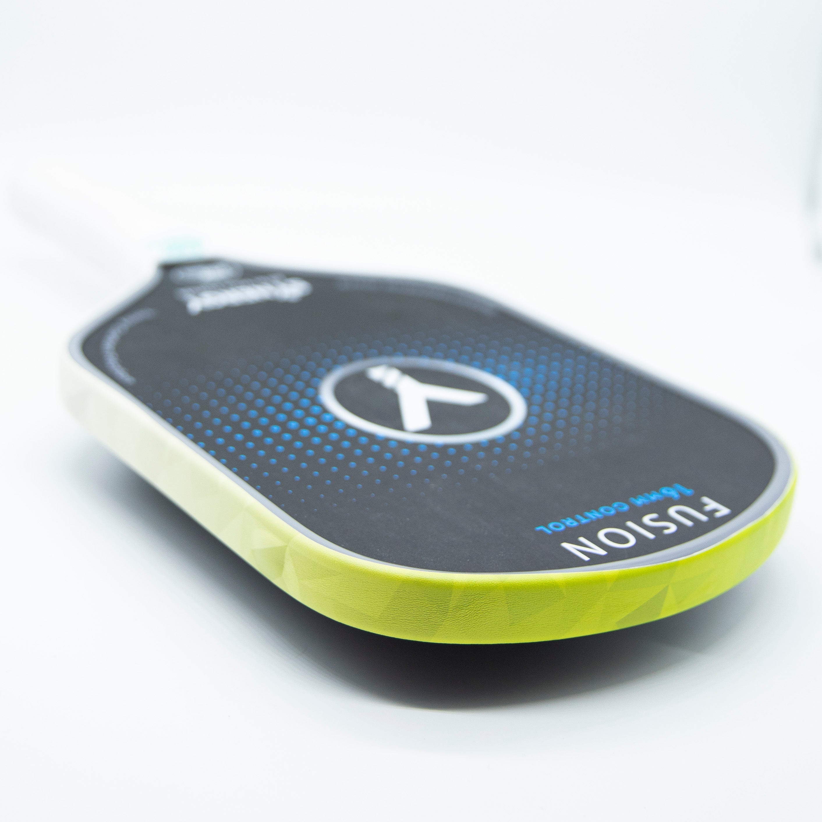 Angled view of a green and black pickleball paddle.
