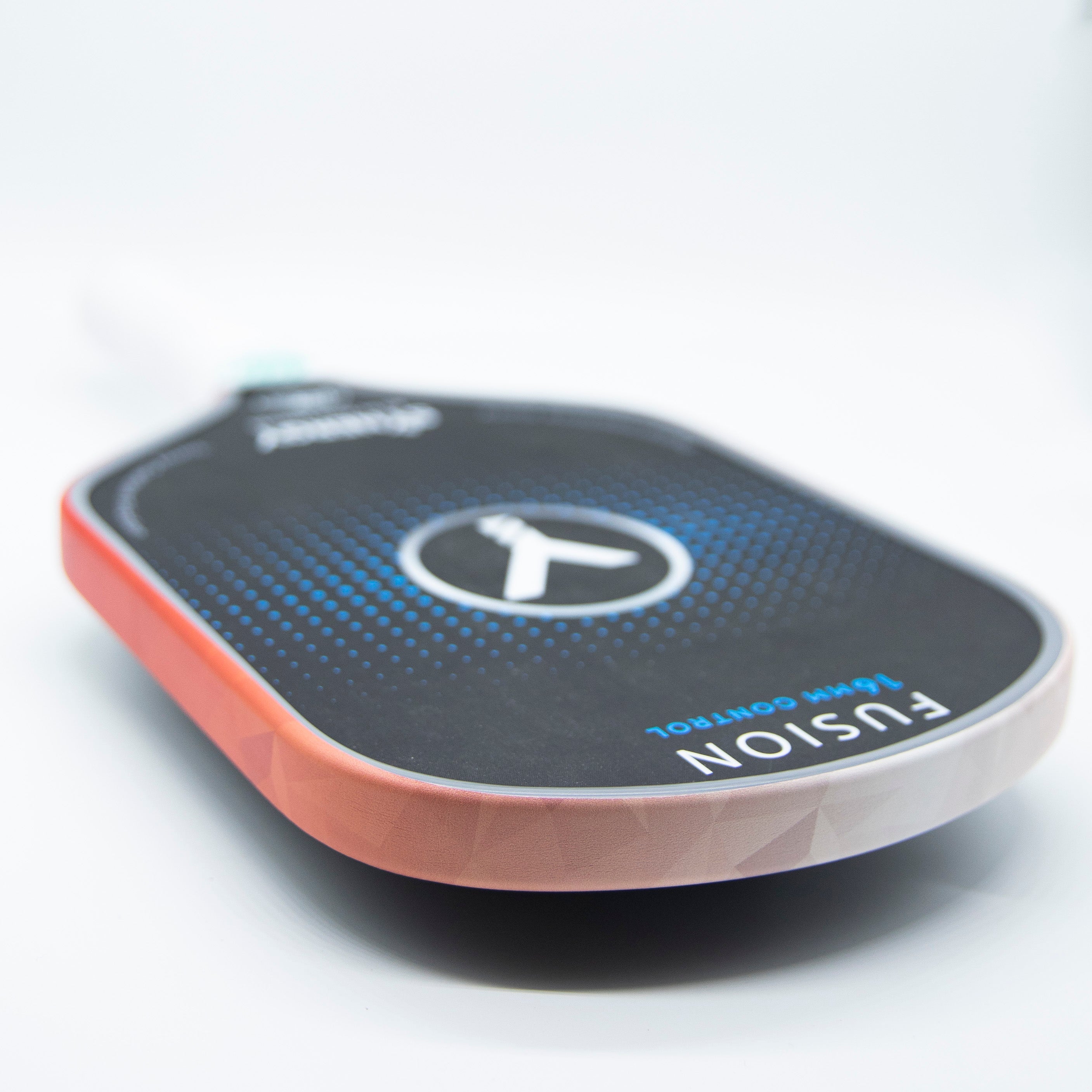 Pickleball paddle with black face and red edging.