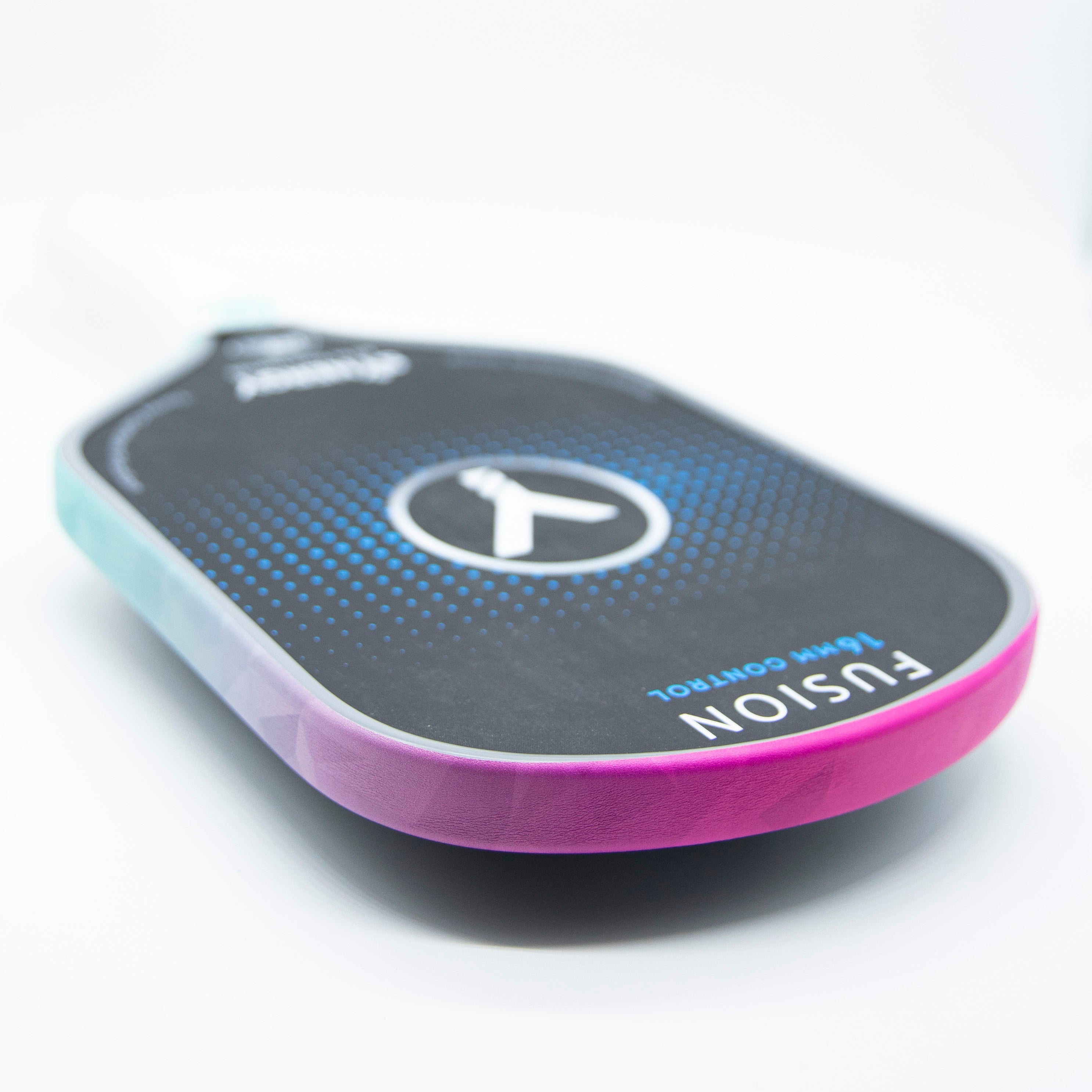 Angled shot of a black, blue, and pink pickleball paddle.