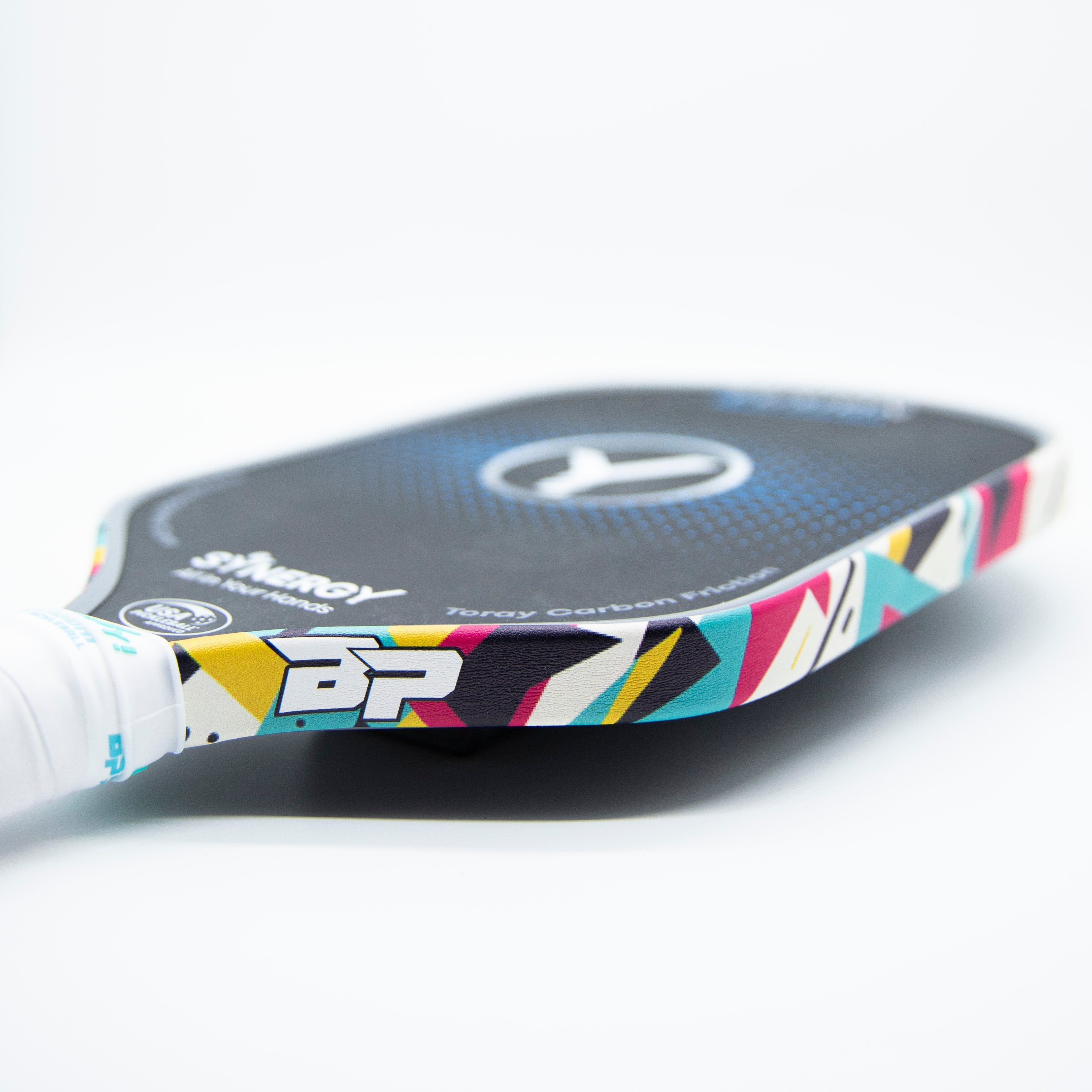 Black, blue, and multicolor paddle with white grip.