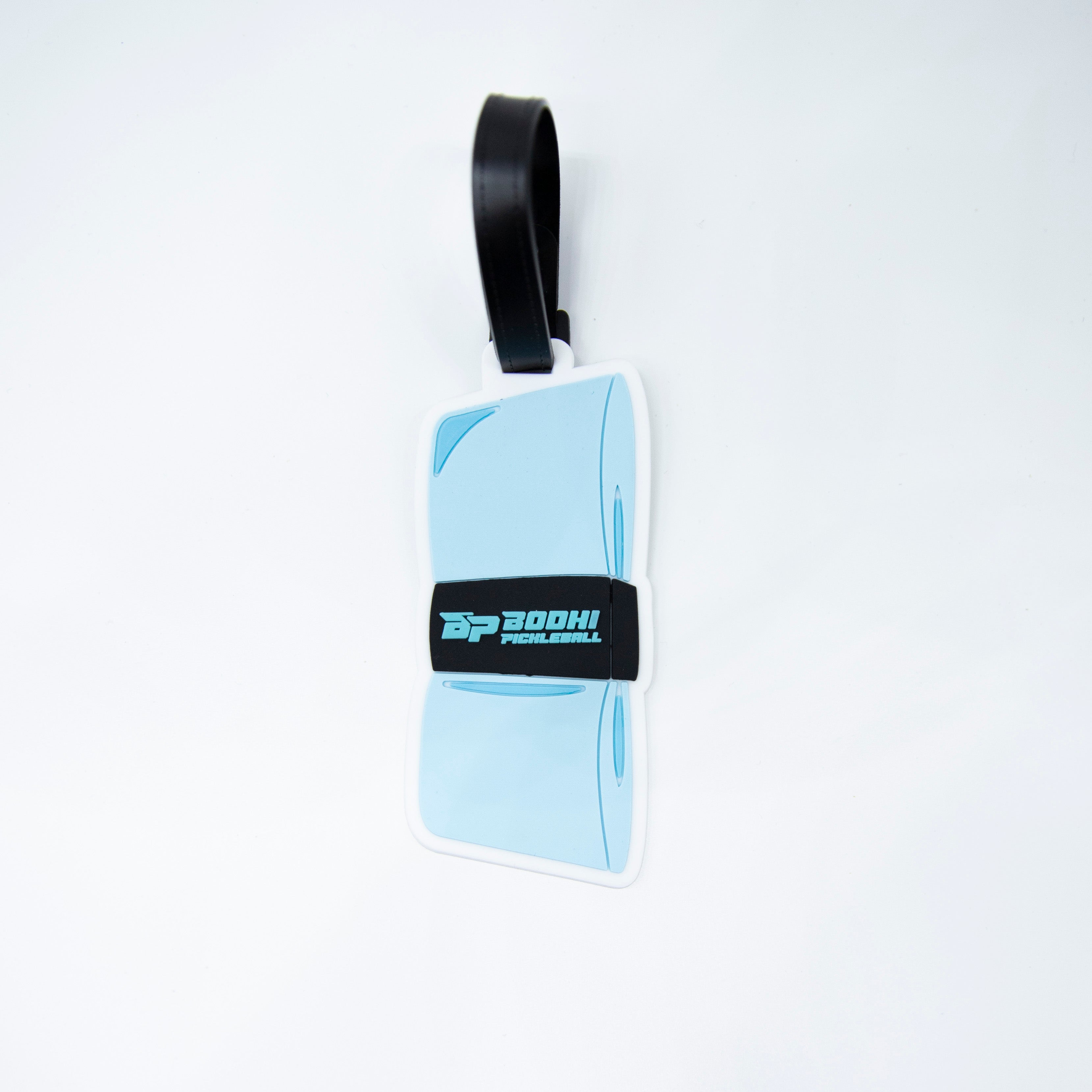 A light blue pickleball paddle luggage tag with a black strap on a white background.